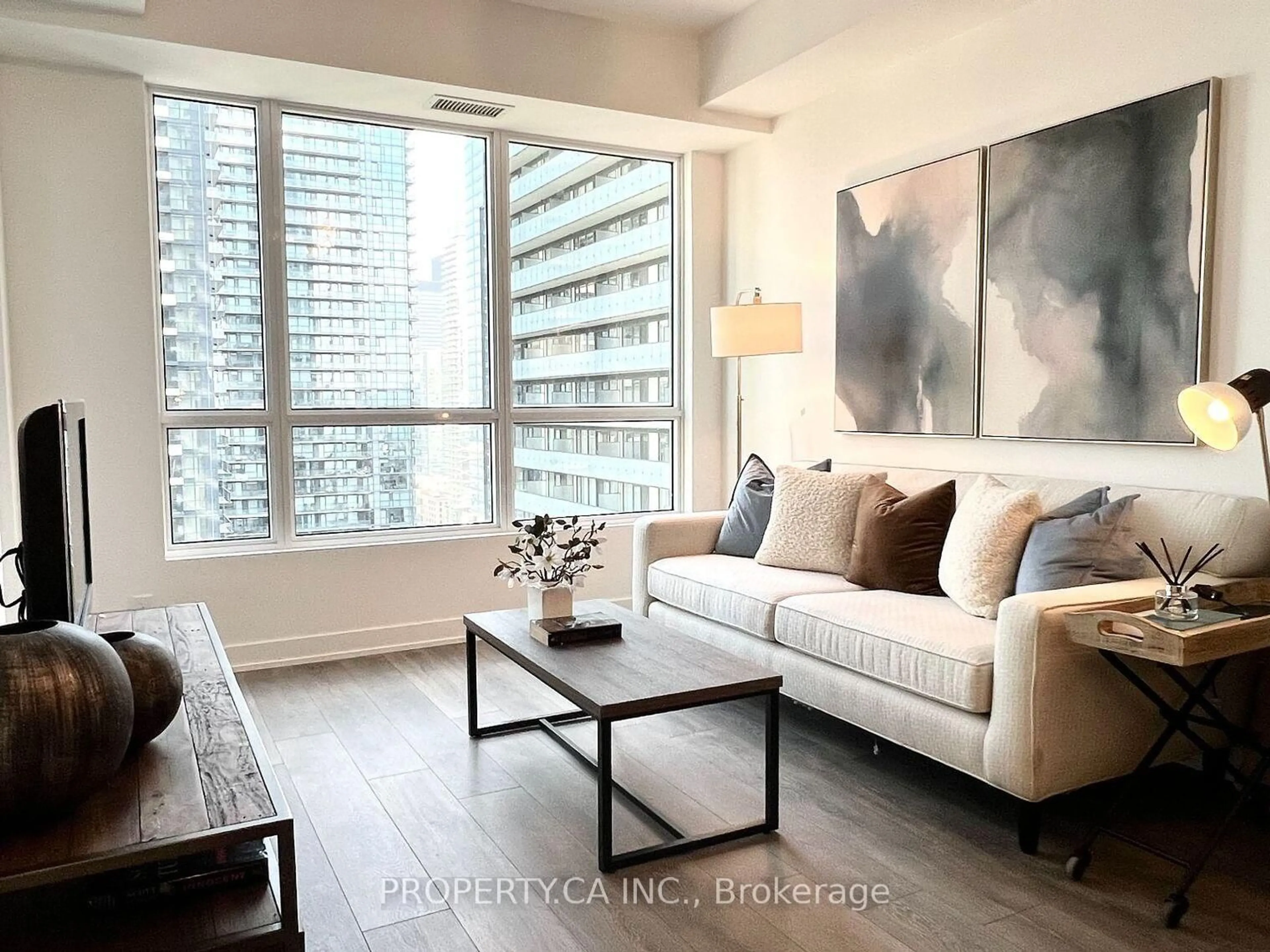 Living room with furniture, wood/laminate floor for 108 Peter St #506, Toronto Ontario M5V 0W2