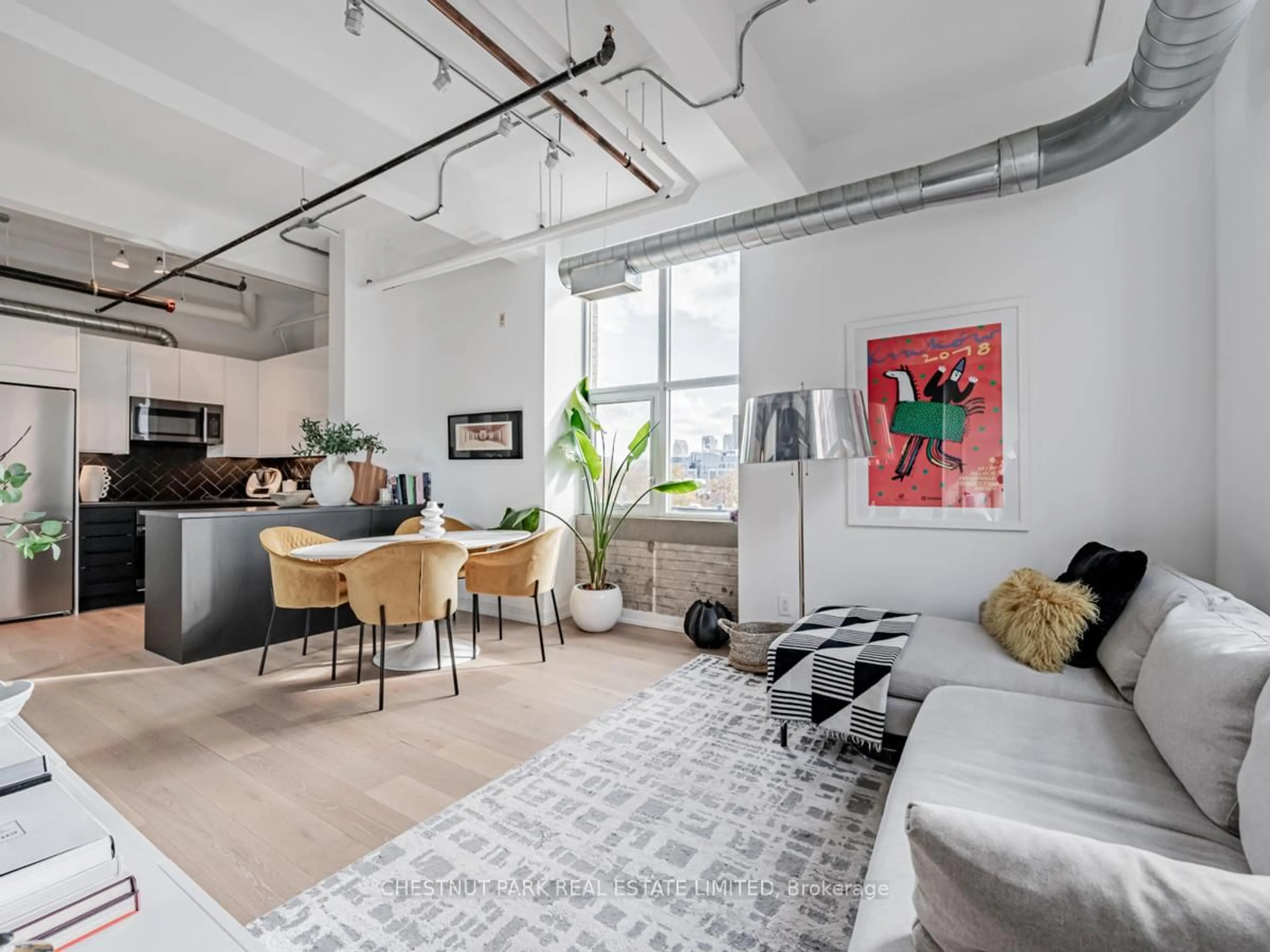 Living room with furniture, cement floor for 955 Queen St #526, Toronto Ontario M6J 3X5