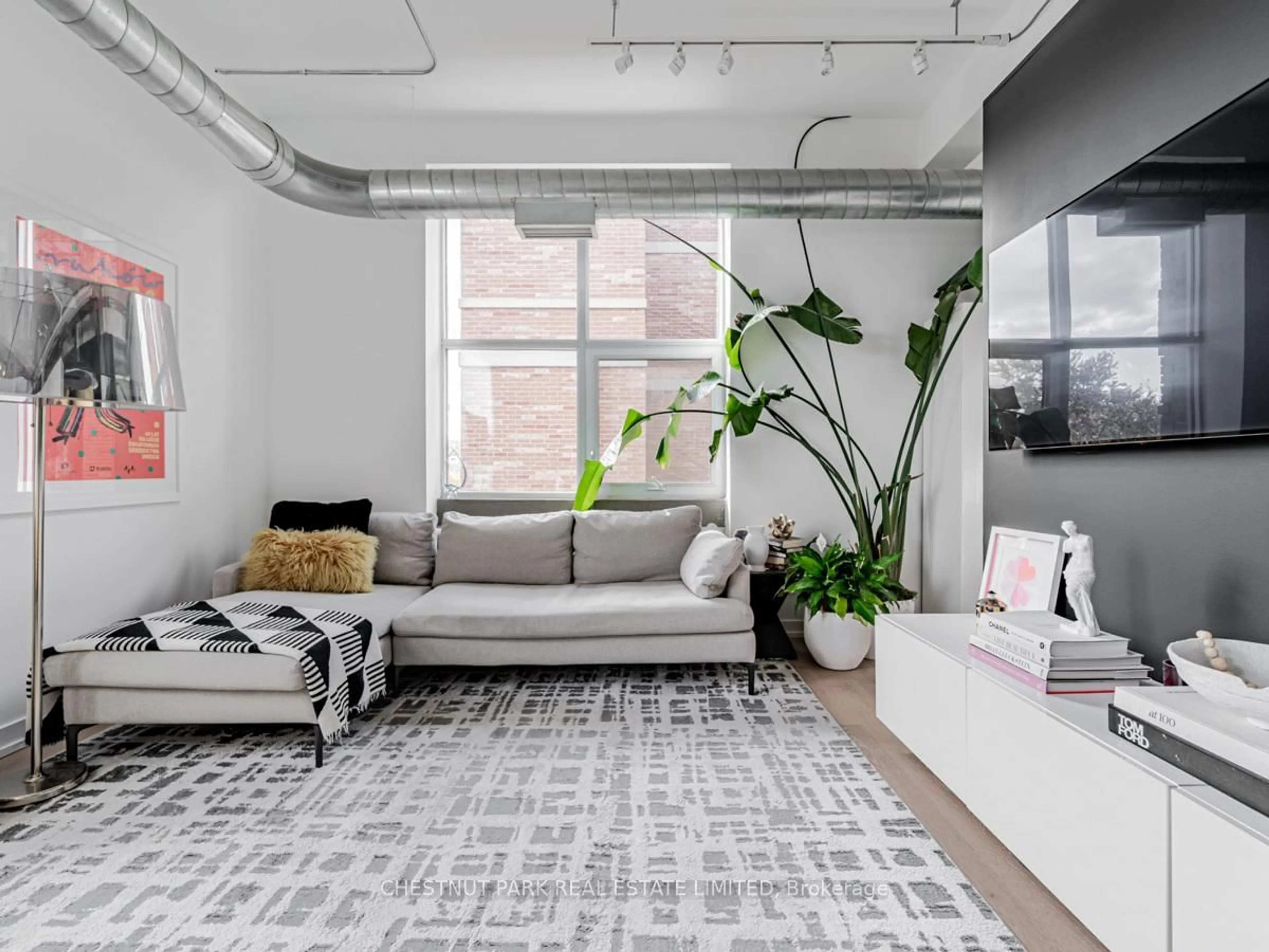 Living room with furniture, cement floor for 955 Queen St #526, Toronto Ontario M6J 3X5
