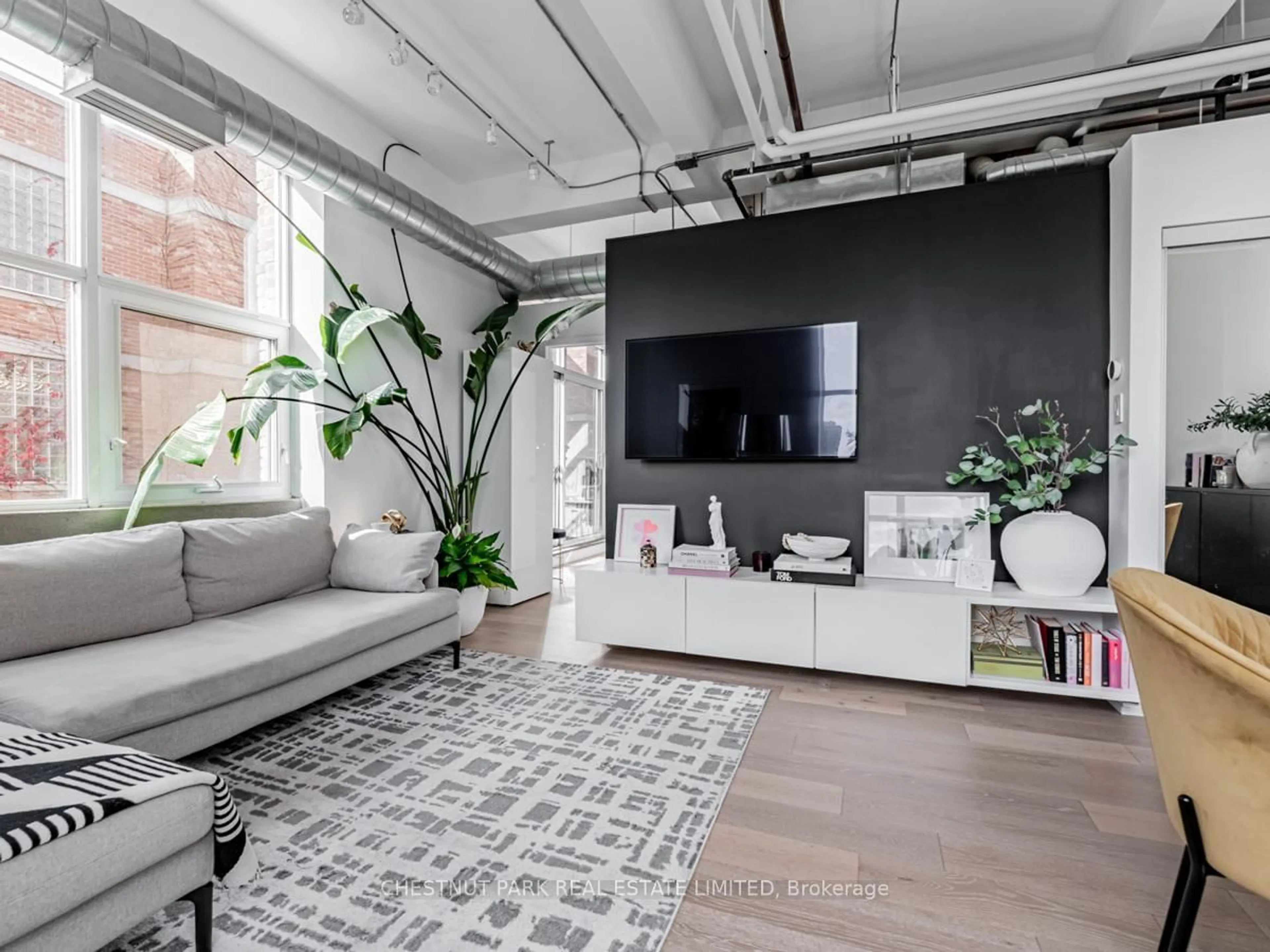 Living room with furniture, cement floor for 955 Queen St #526, Toronto Ontario M6J 3X5