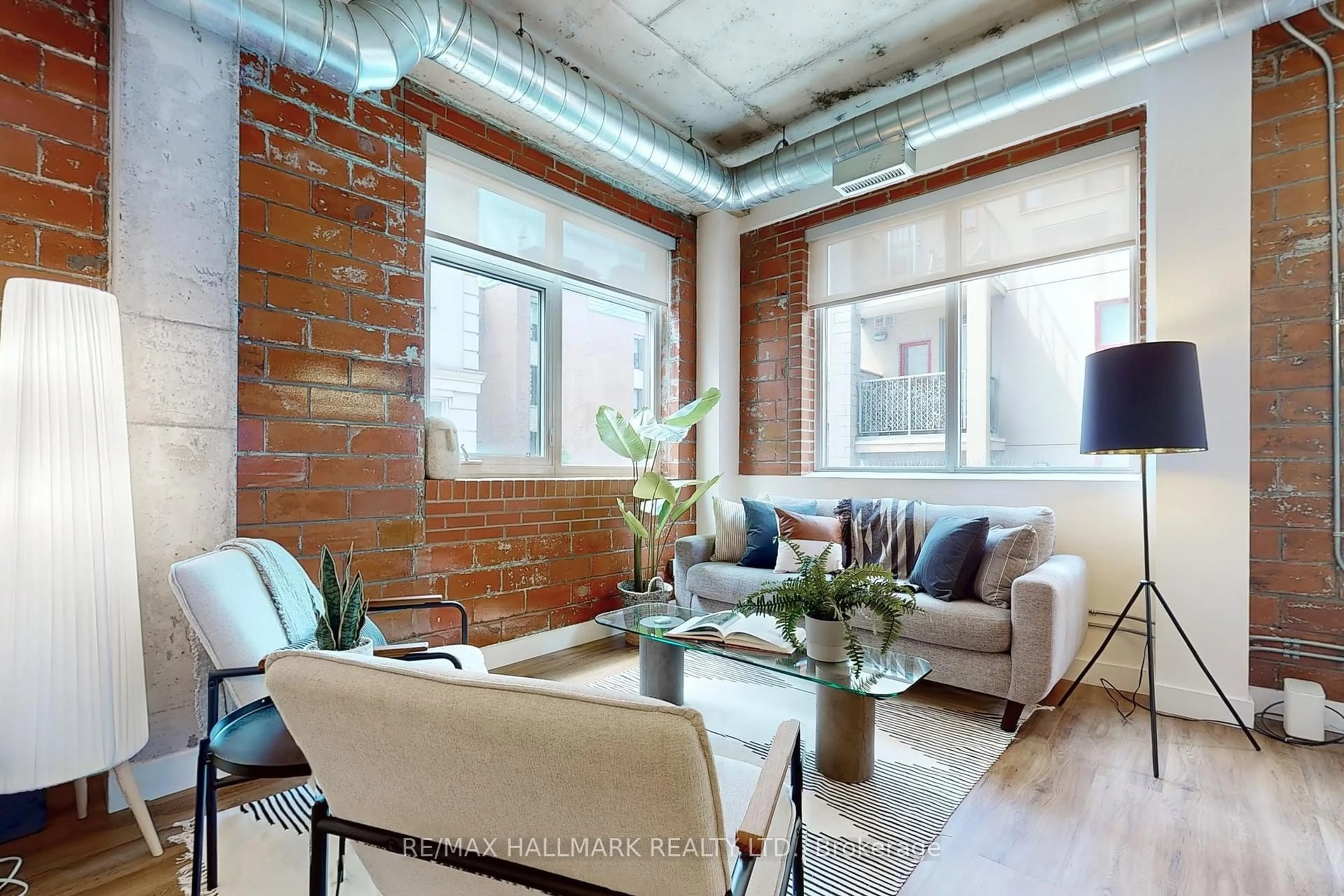Living room with furniture, unknown for 10 Wellesley Pl #206, Toronto Ontario M4Y 1B1