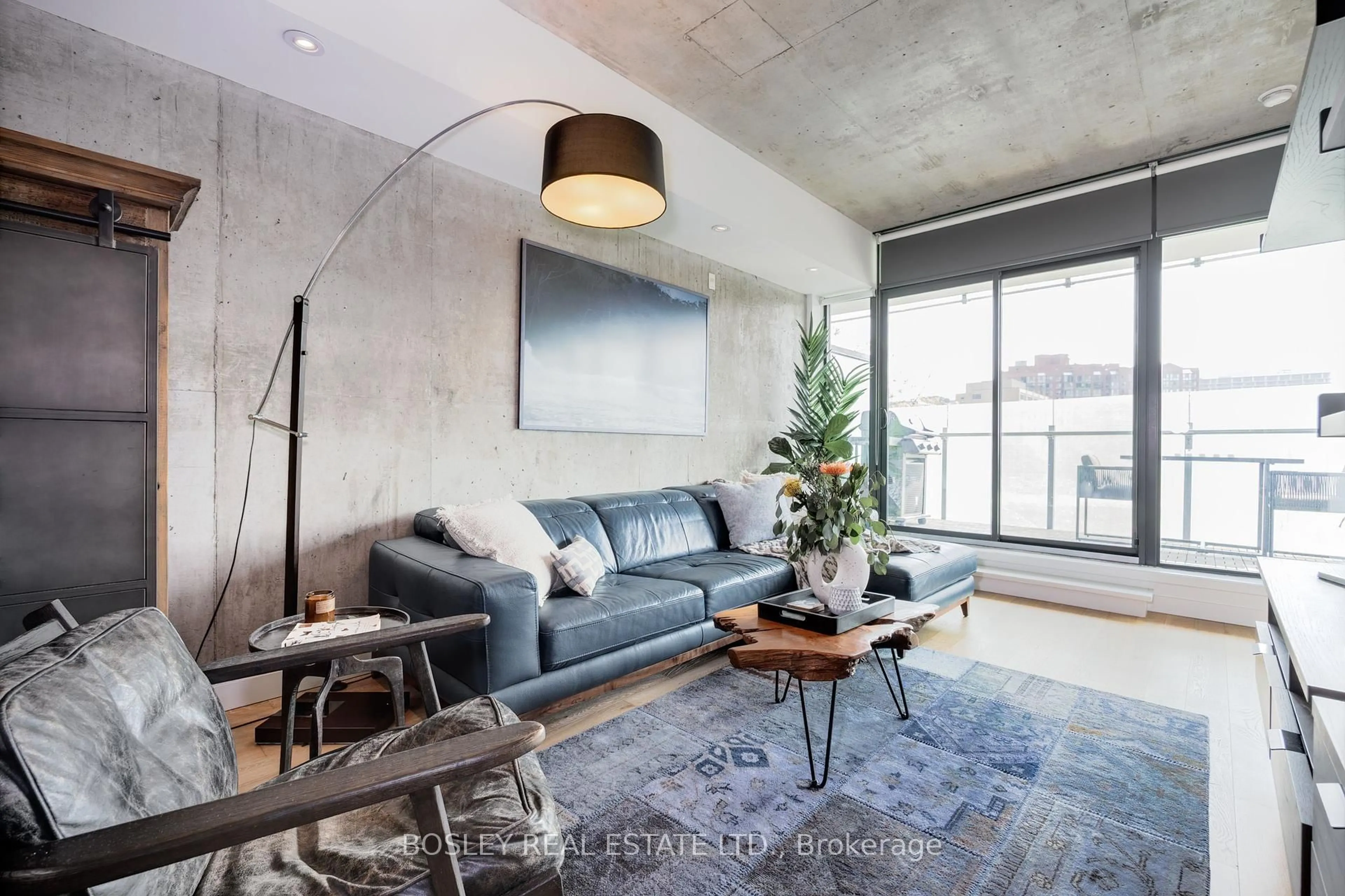 Living room with furniture, cement floor for 25 Stafford St #303, Toronto Ontario M5V 0G3