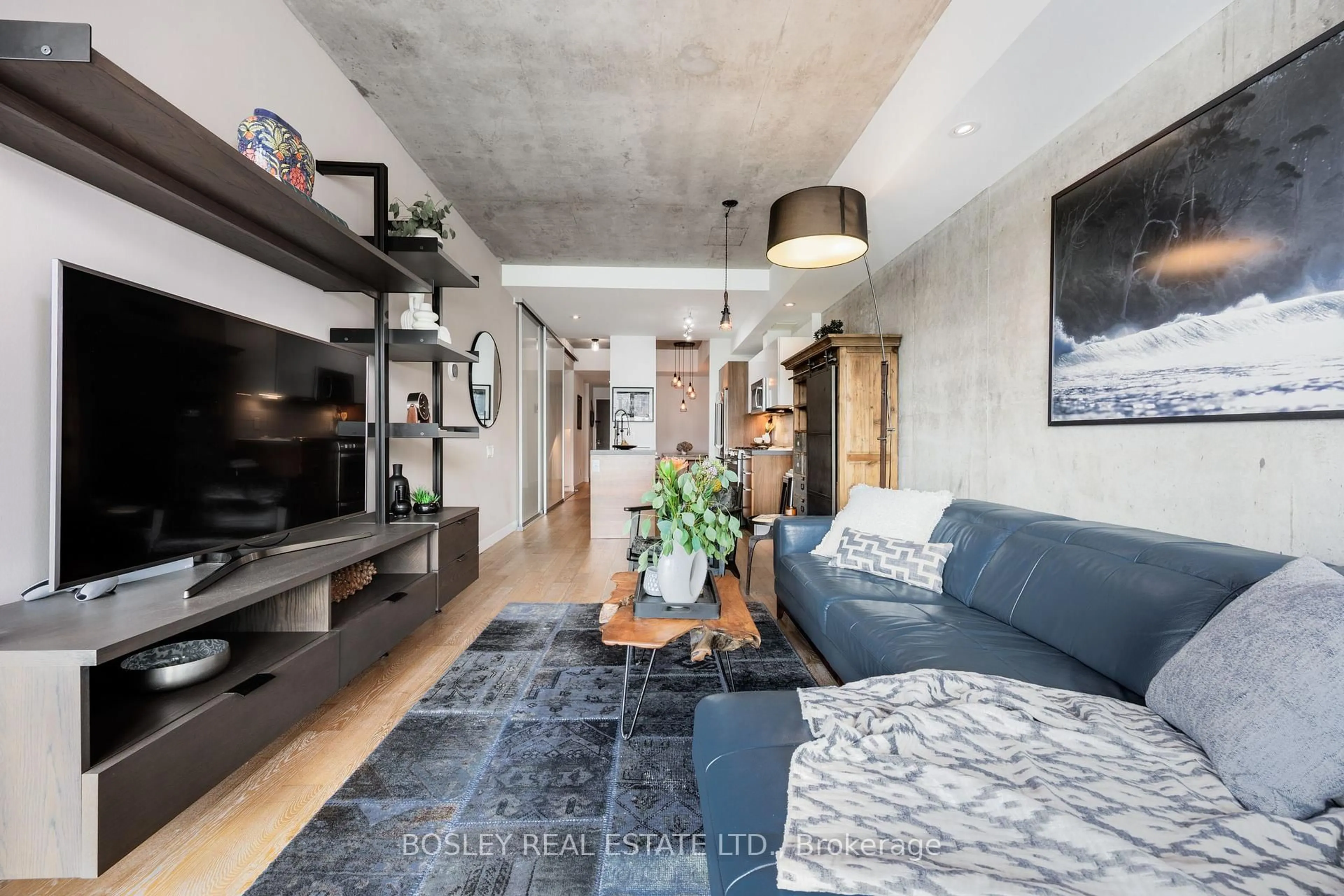 Living room with furniture, cement floor for 25 Stafford St #303, Toronto Ontario M5V 0G3