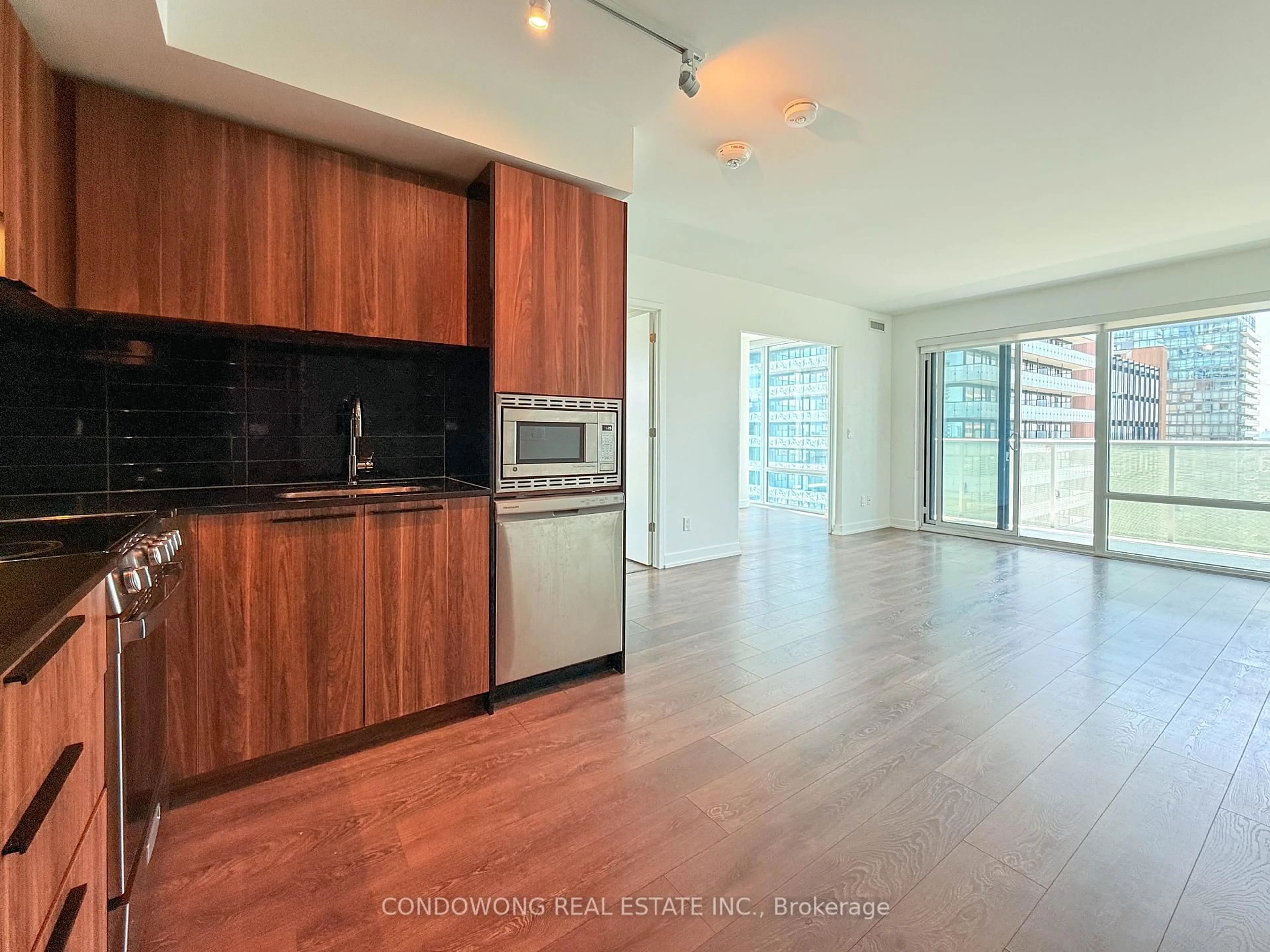 Open concept kitchen, wood/laminate floor for 501 Yonge St #2312, Toronto Ontario M4Y 0G8