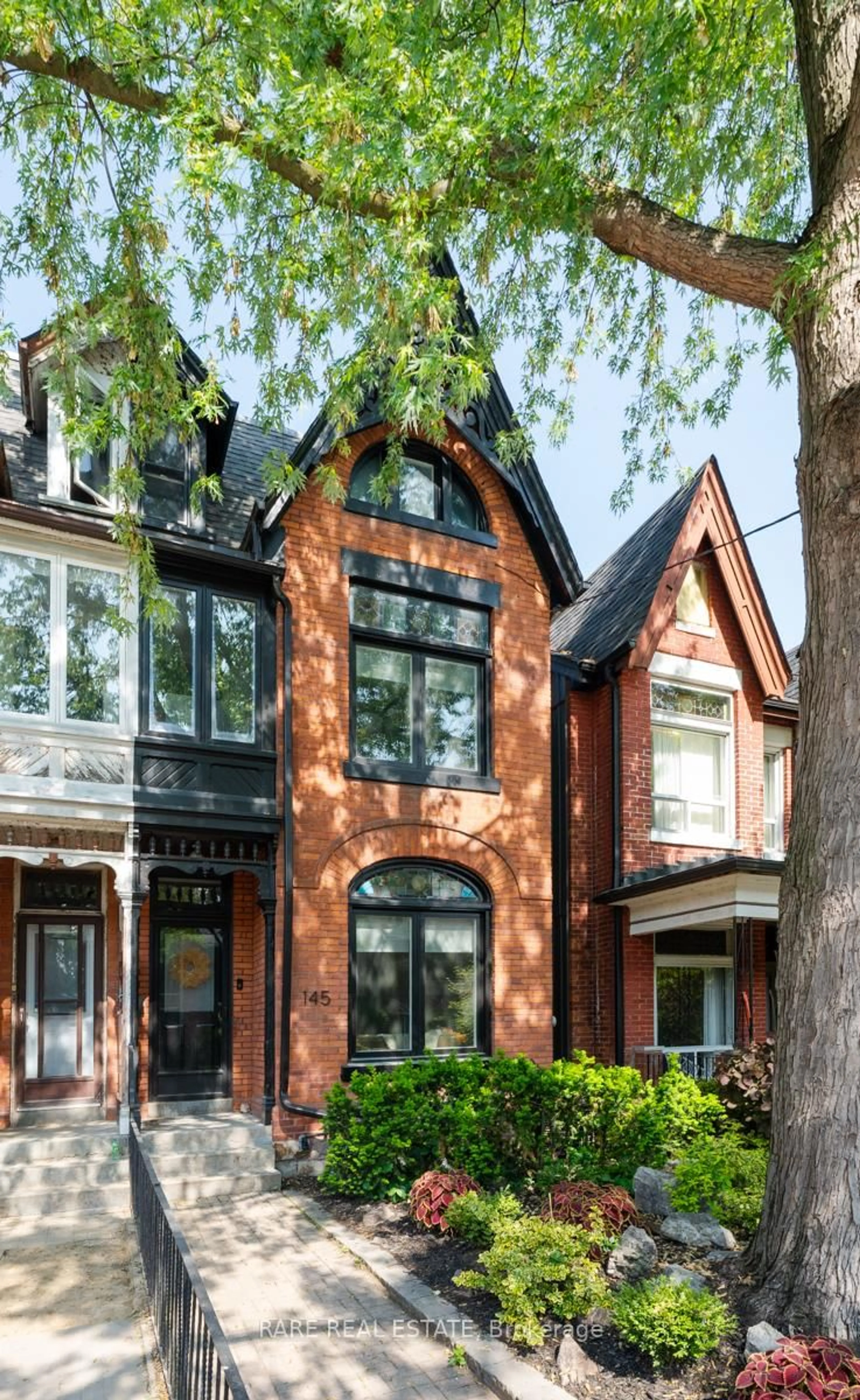 Home with brick exterior material, street for 145 Beaconsfield Ave, Toronto Ontario M6J 3J5