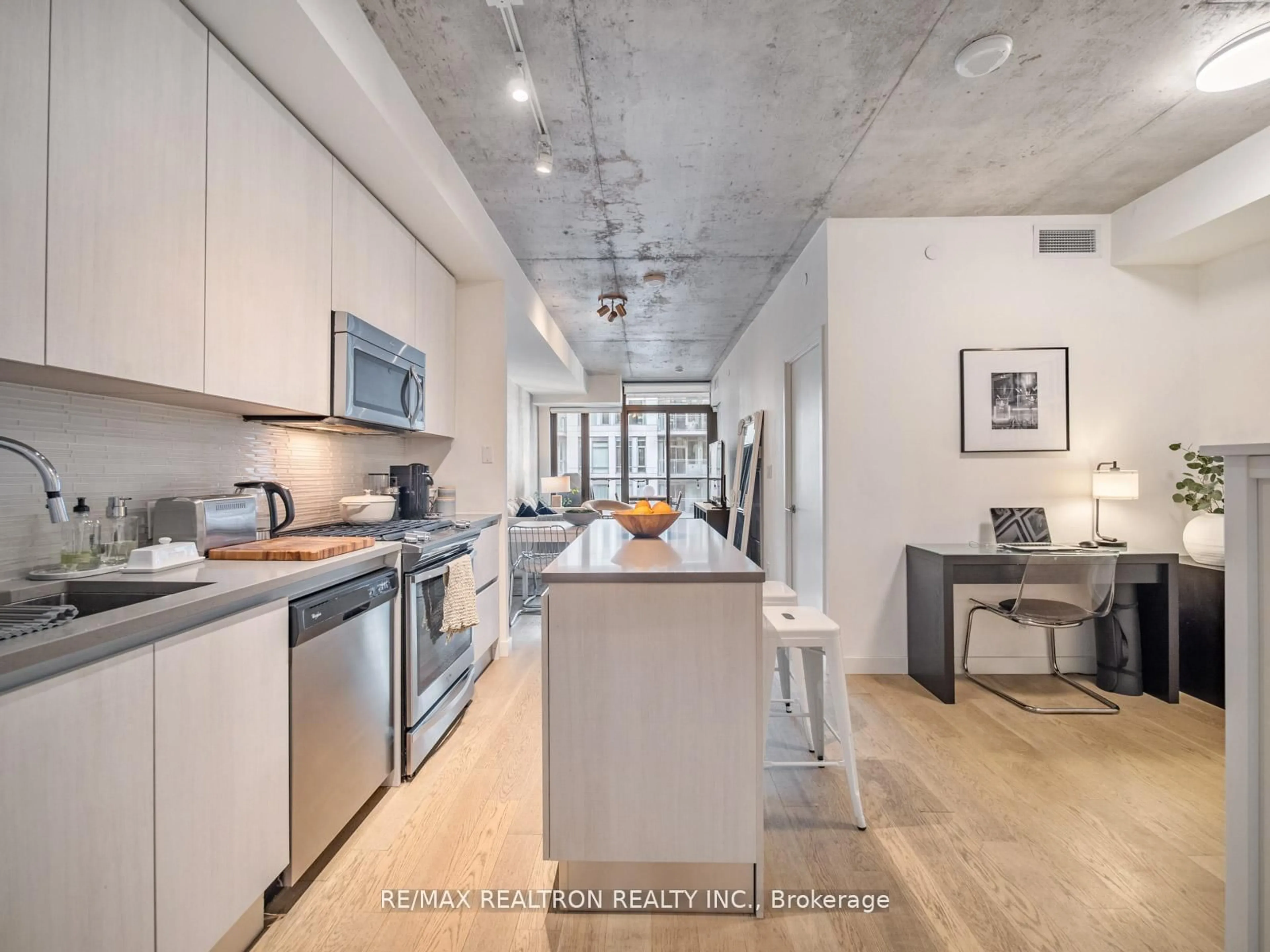 Open concept kitchen, cement floor for 111 Bathurst St #1217, Toronto Ontario M5V 2R1