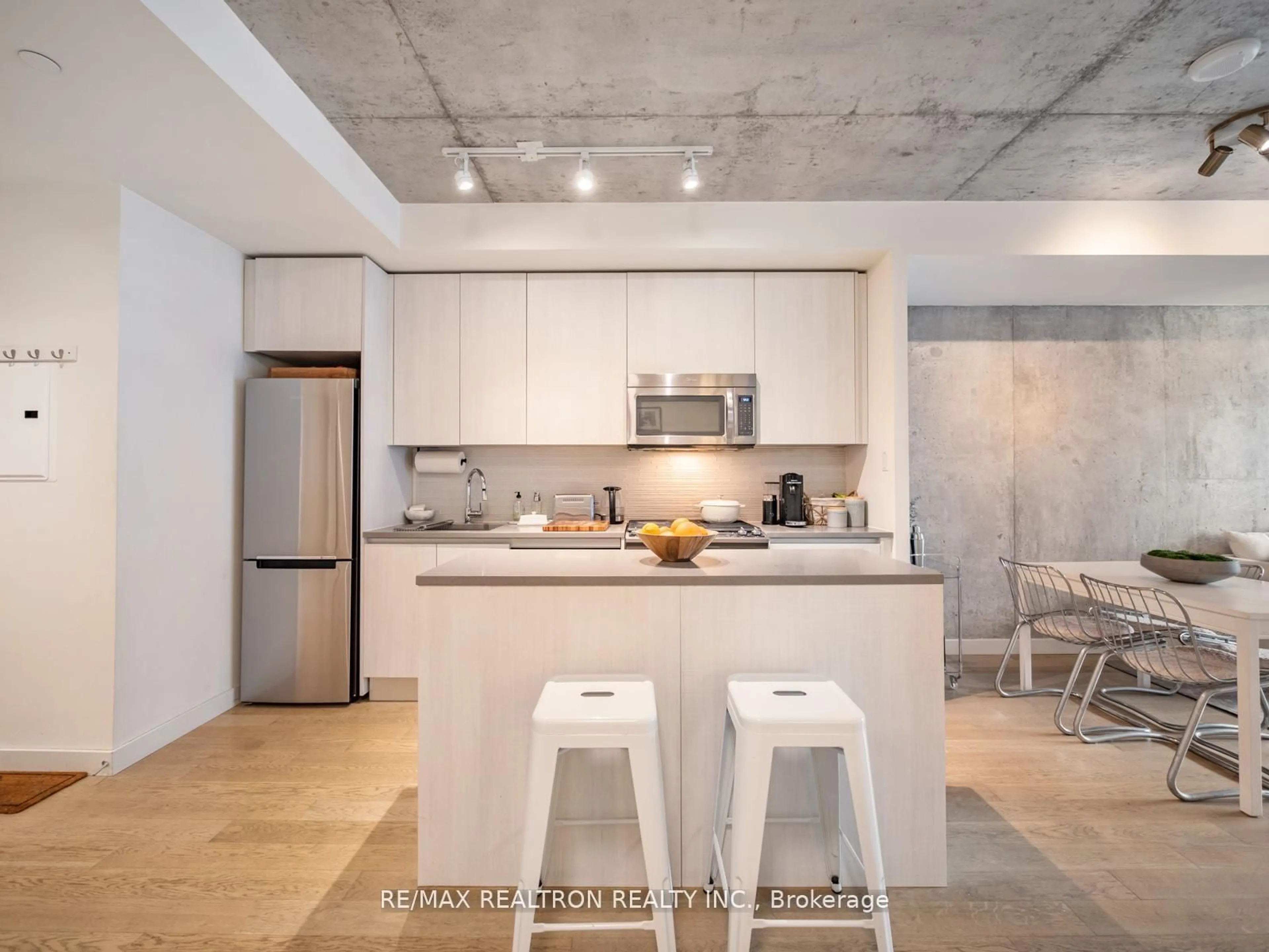 Open concept kitchen, cement floor for 111 Bathurst St #1217, Toronto Ontario M5V 2R1