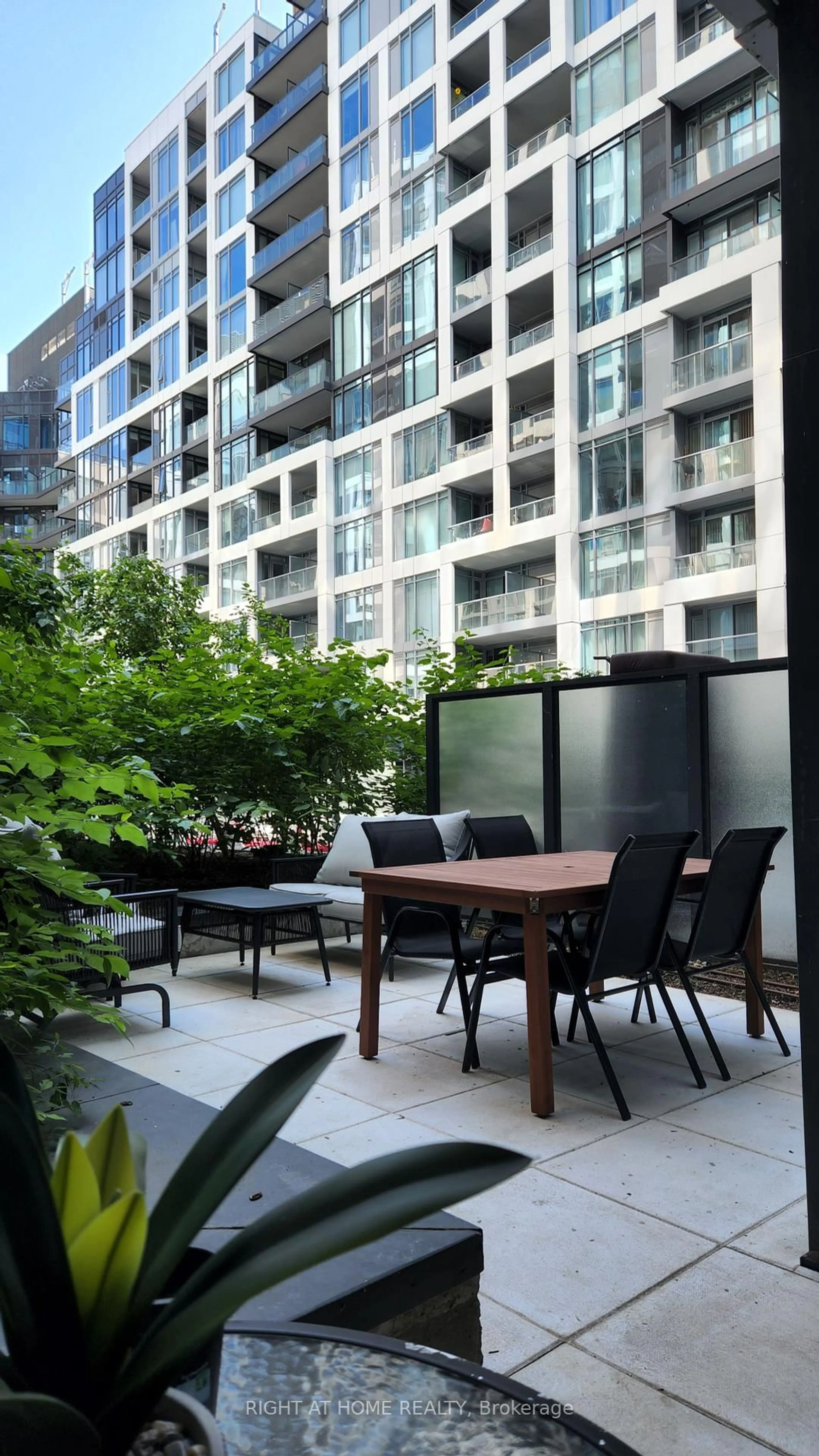 Patio, city buildings view from balcony for 576 Front St #210, Toronto Ontario M5V 0P8