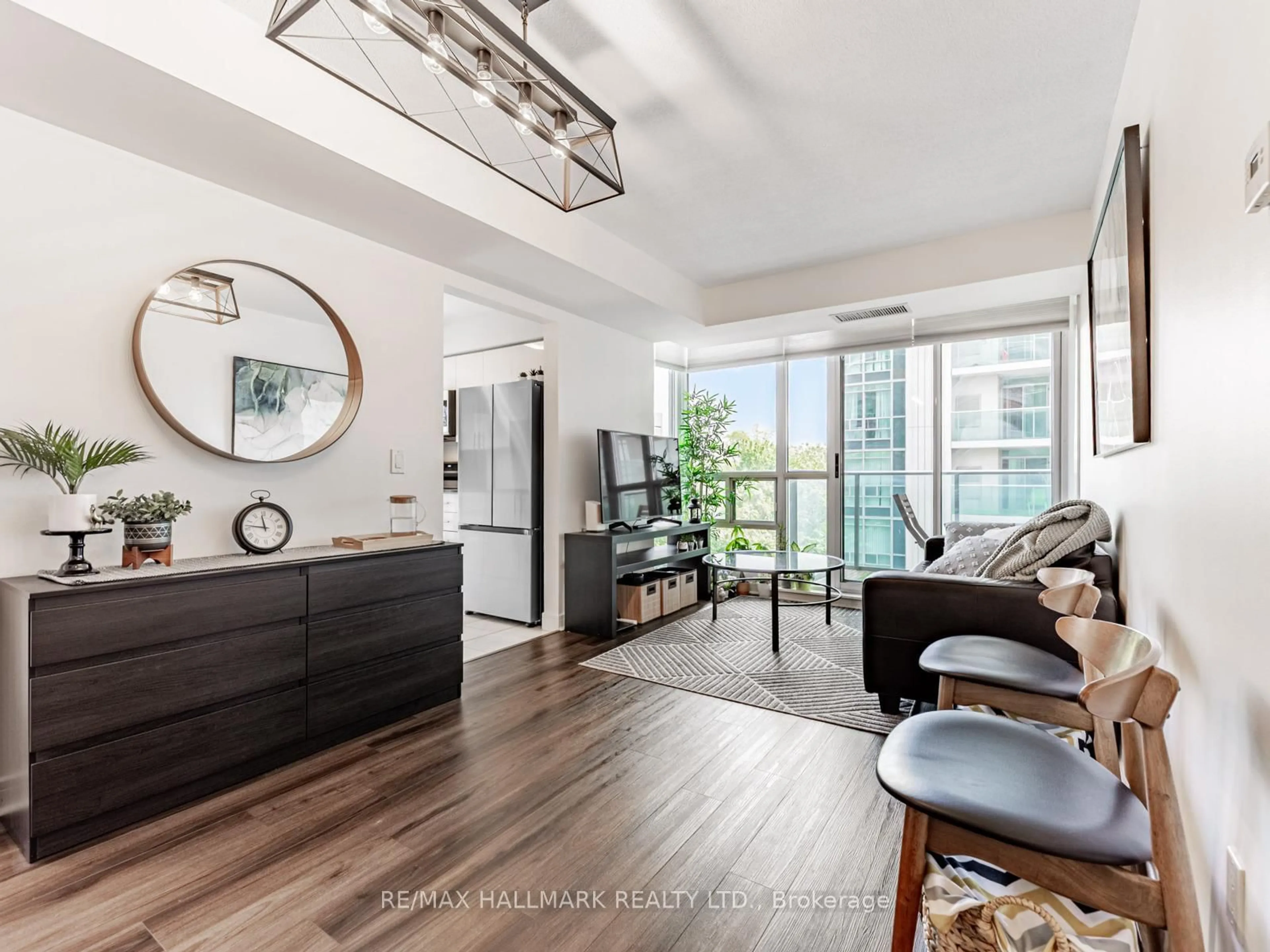 Living room with furniture, wood/laminate floor for 31 Bales Ave #610, Toronto Ontario M2N 7L6