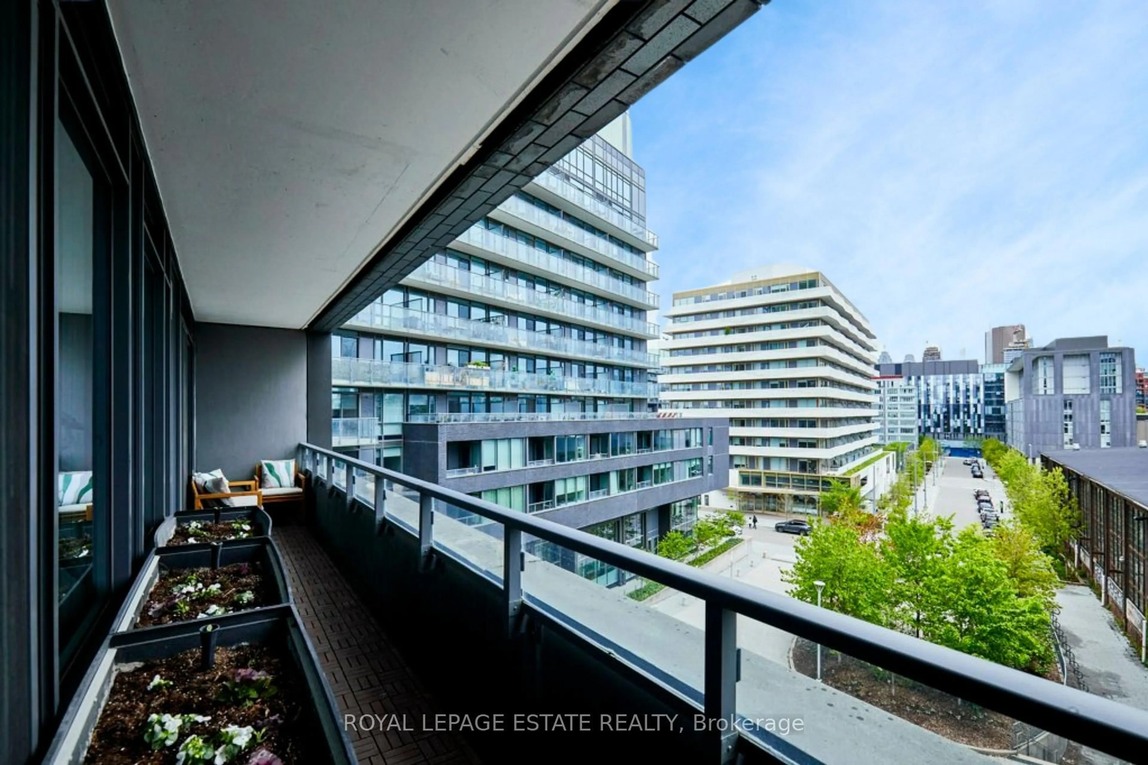 Balcony in the apartment, city buildings view from balcony for 120 Bayview Ave #N419, Toronto Ontario M5A 0G4