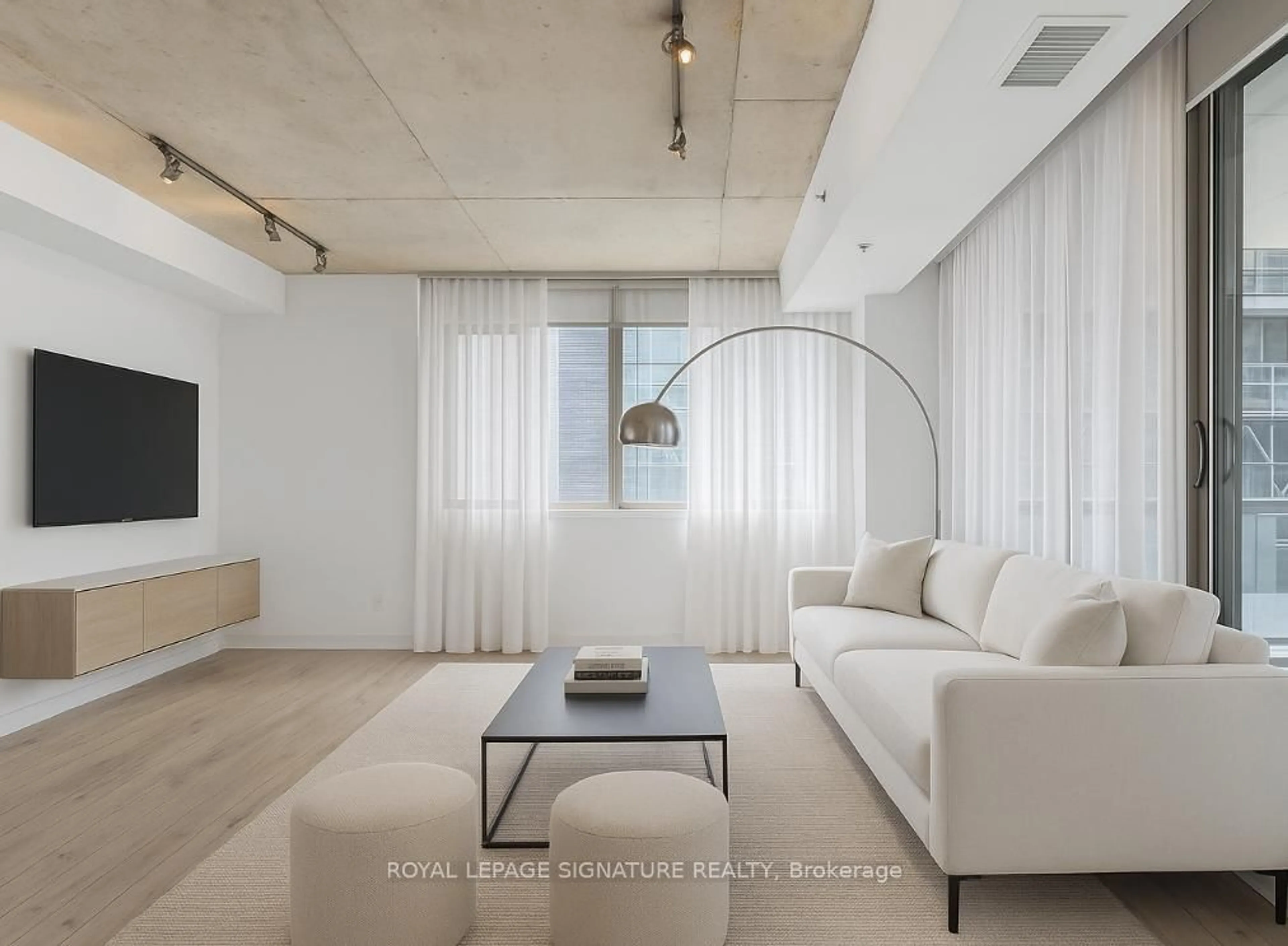 Living room with furniture, cement floor for 8 Gladstone Ave #213, Toronto Ontario M6J 3K6