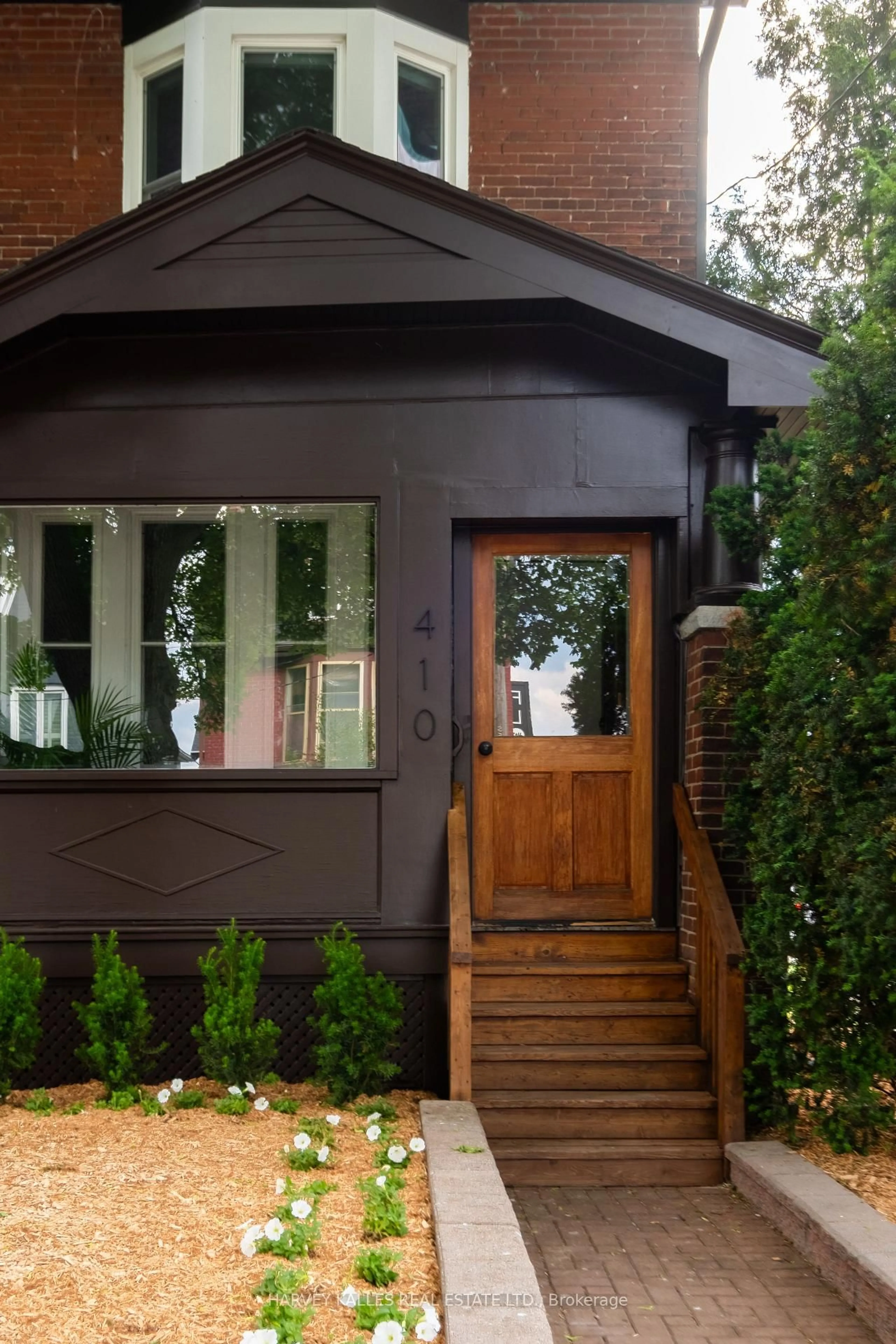 Home with brick exterior material, street for 410 Roxton Rd, Toronto Ontario M6G 3R2