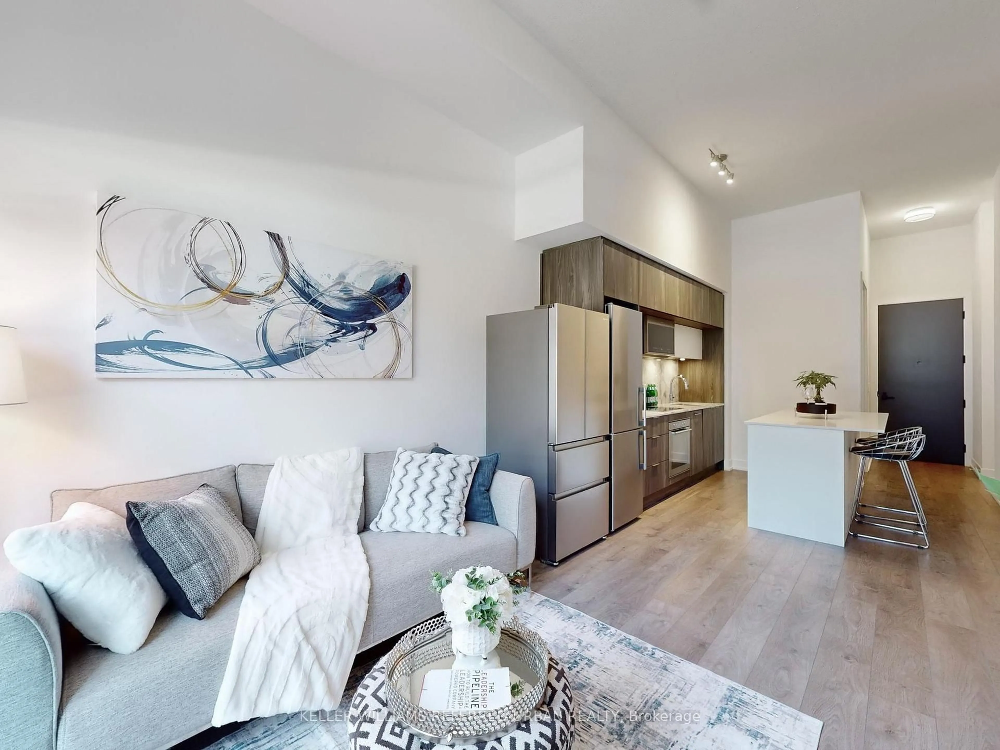 Living room with furniture, wood/laminate floor for 25 Arda Grado Way #239, Toronto Ontario M2J 0H6