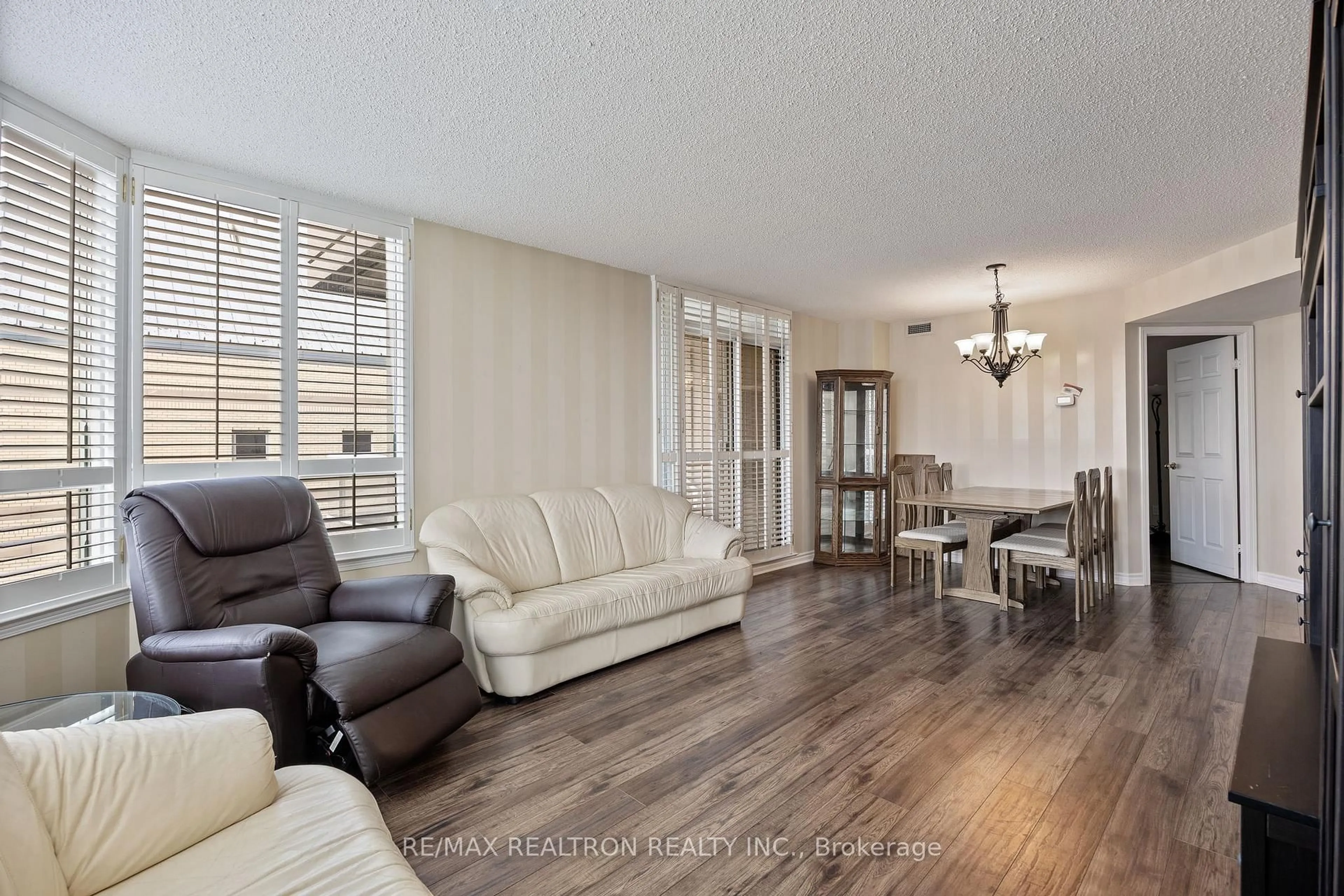 Living room with furniture, wood/laminate floor for 8 Covington Rd #504, Toronto Ontario M6A 3E5