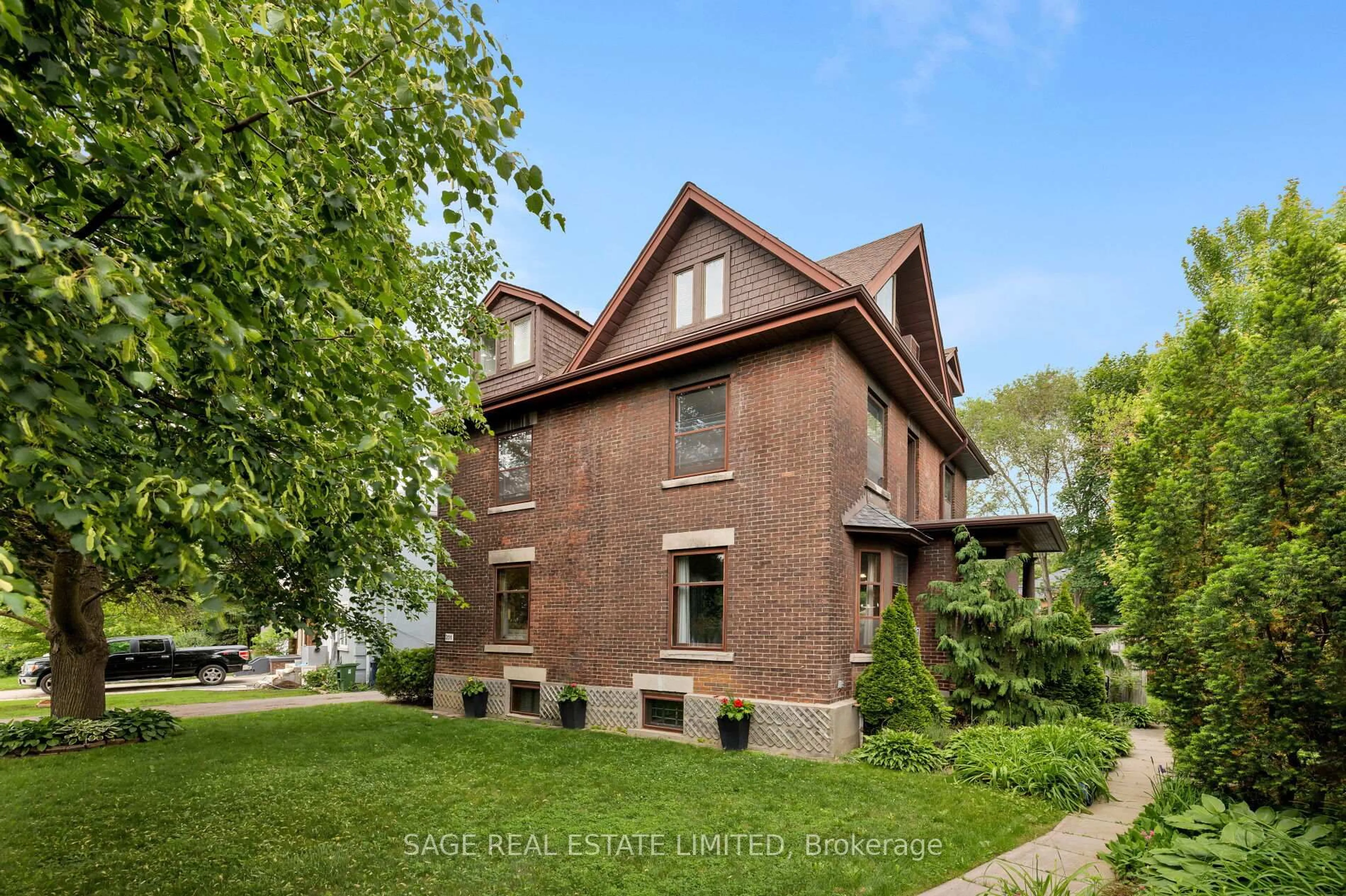 Home with brick exterior material, street for 201 Sutherland Dr, Toronto Ontario M4G 1J1