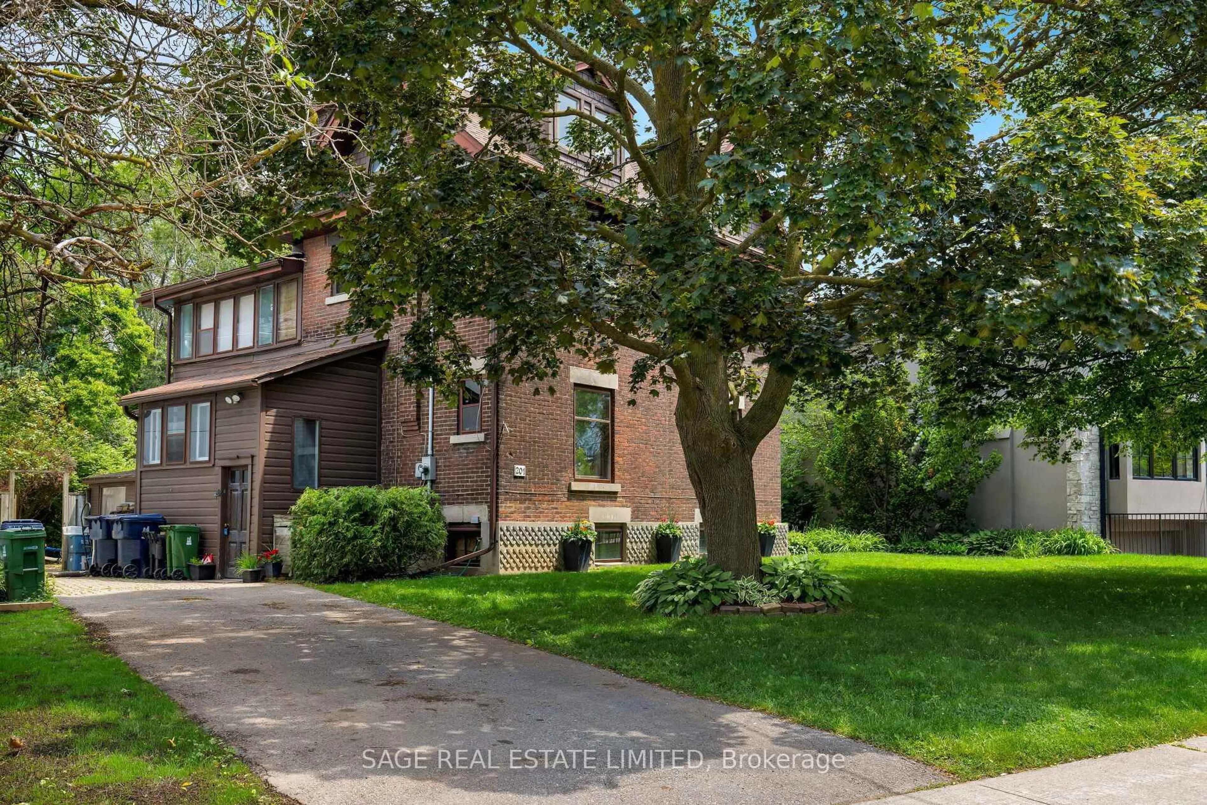 Home with brick exterior material, street for 201 Sutherland Dr, Toronto Ontario M4G 1J1