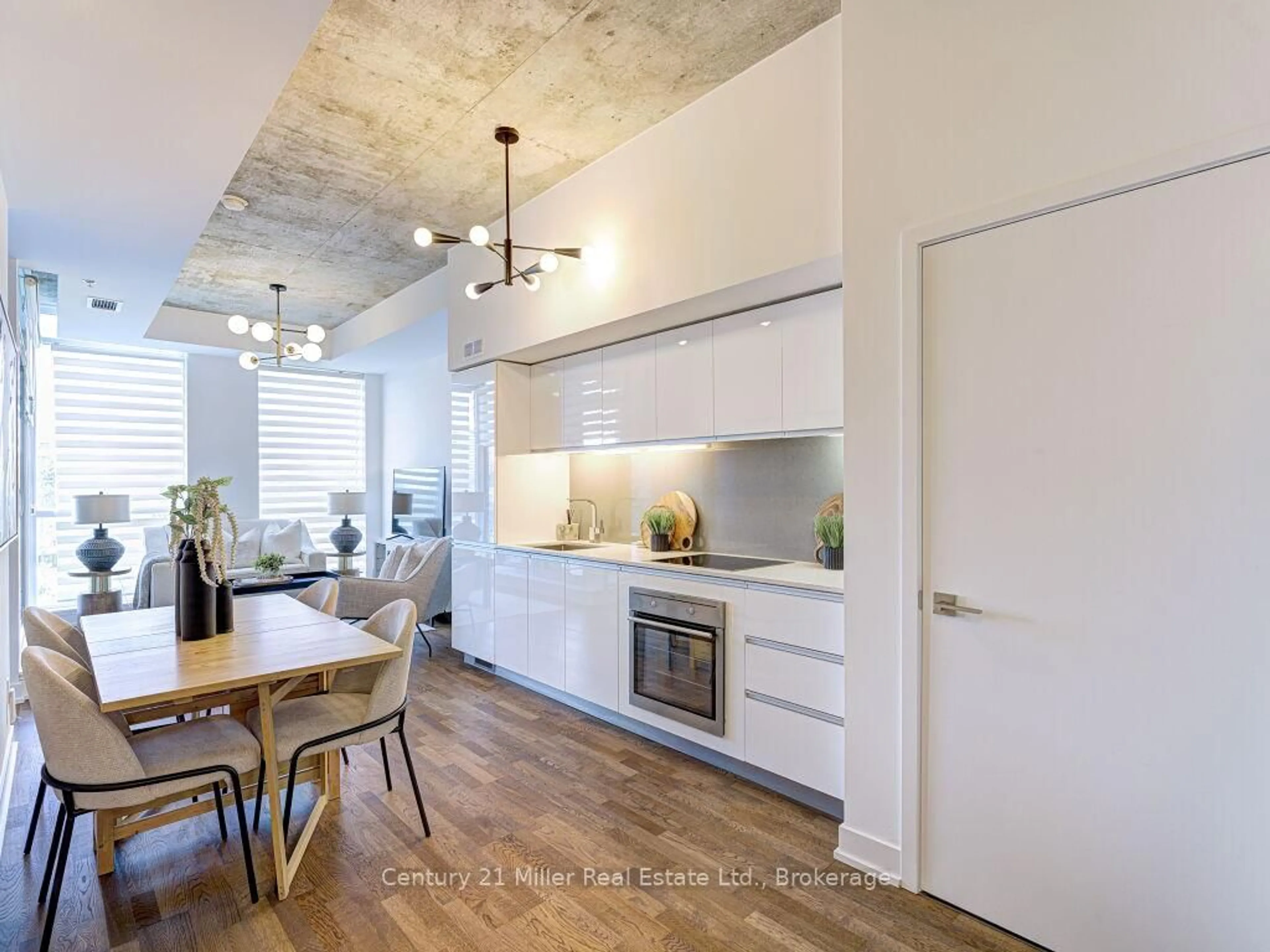 Open concept kitchen, cement floor for 20 Minowan Miikan Lane #313, Toronto Ontario M6J 0E5