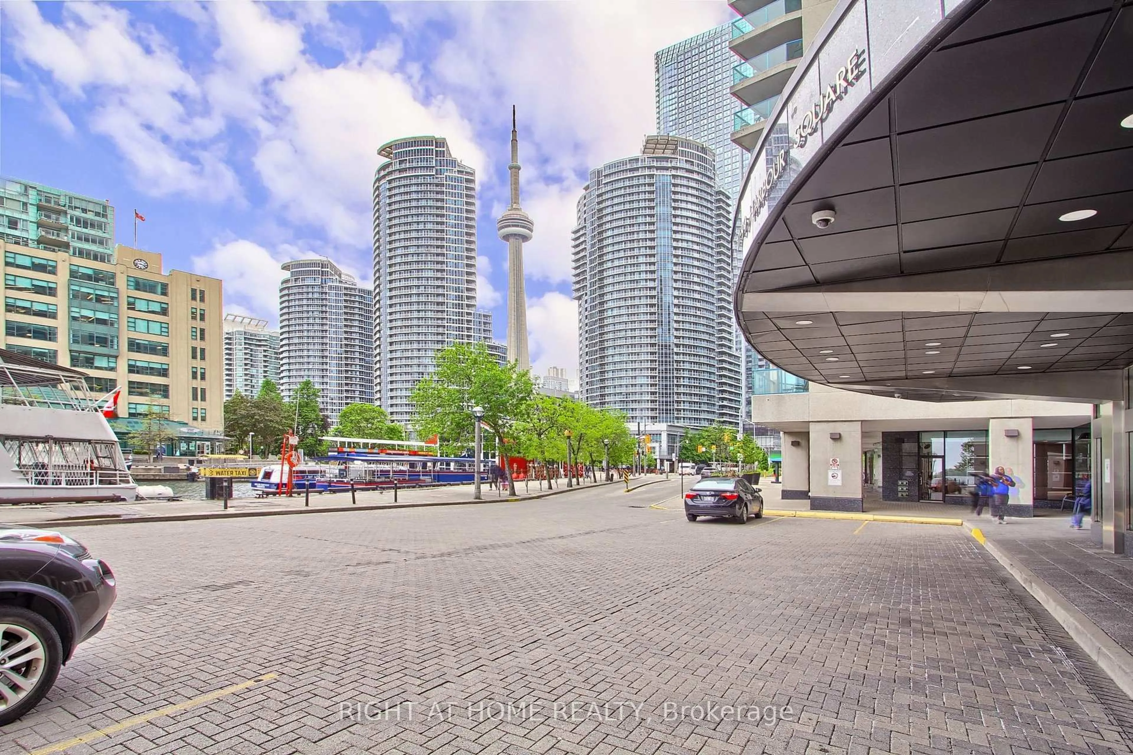 Patio, city buildings view from balcony for 77 Harbour Sq #504, Toronto Ontario M5J 2S2