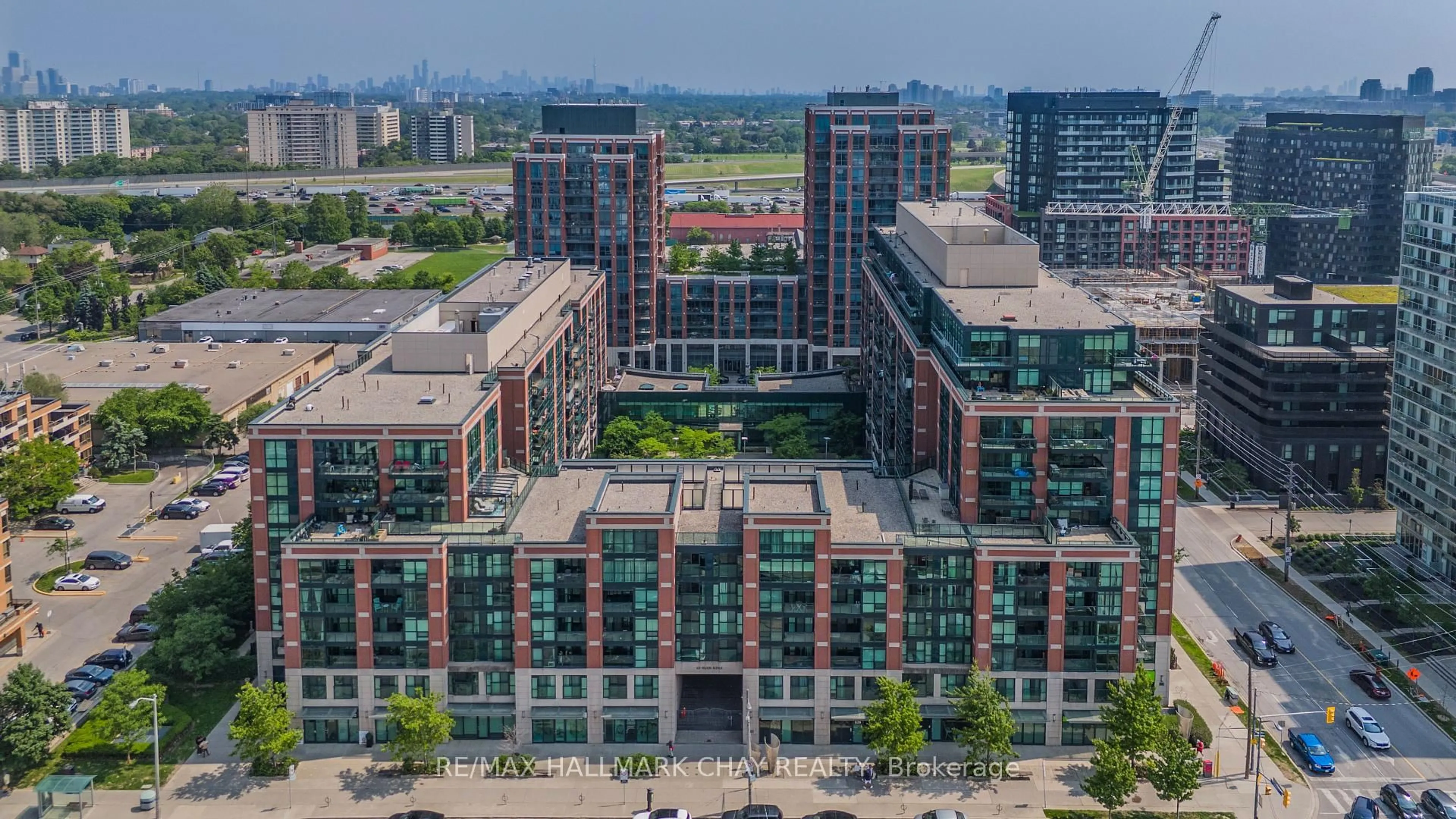 A pic from outside/outdoor area/front of a property/back of a property/a pic from drone, city buildings view from balcony for 525 Wilson Ave #332, Toronto Ontario M3H 0A7