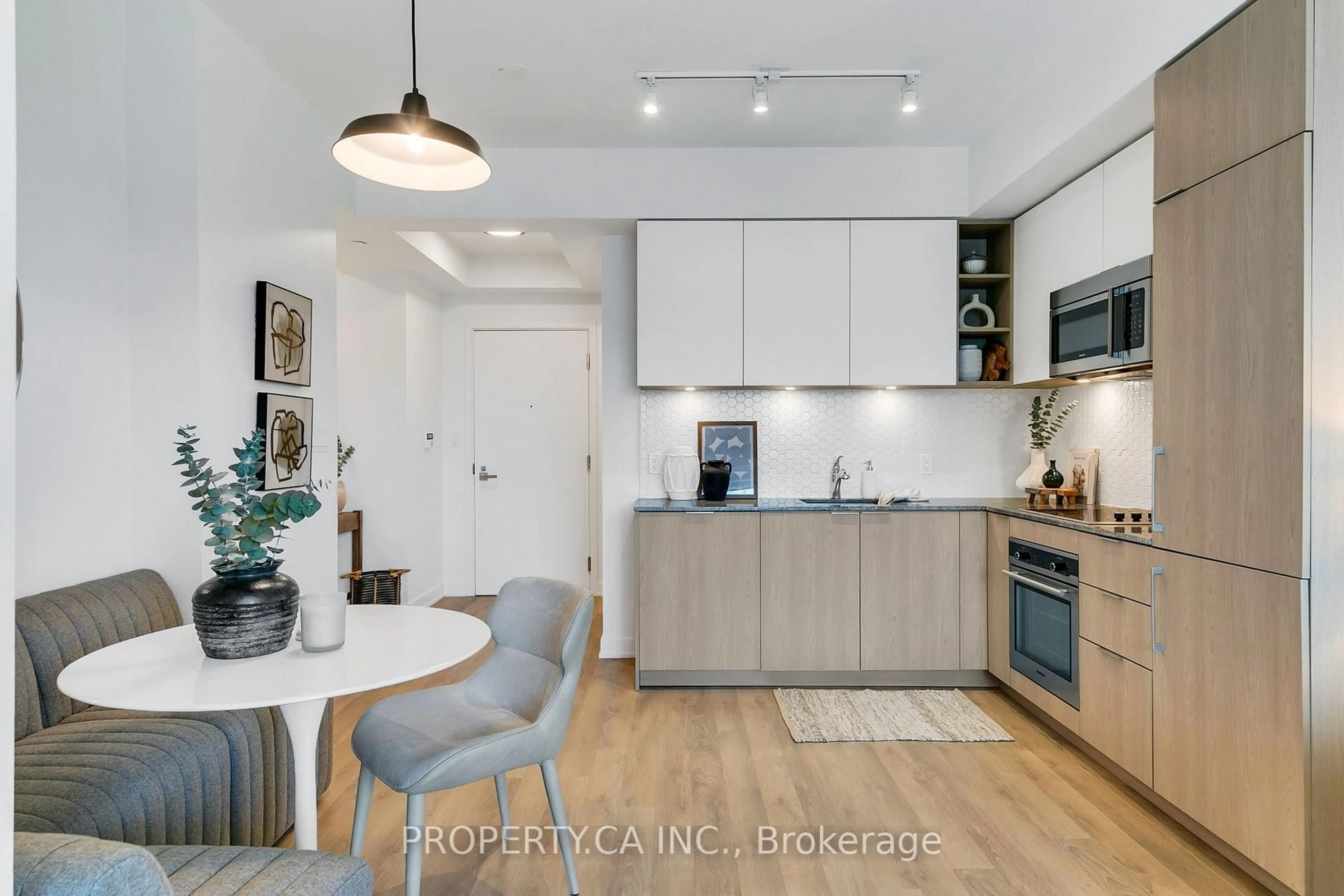 Open concept kitchen, wood/laminate floor for 50 Ordnance St #710, Toronto Ontario M6K 0C9