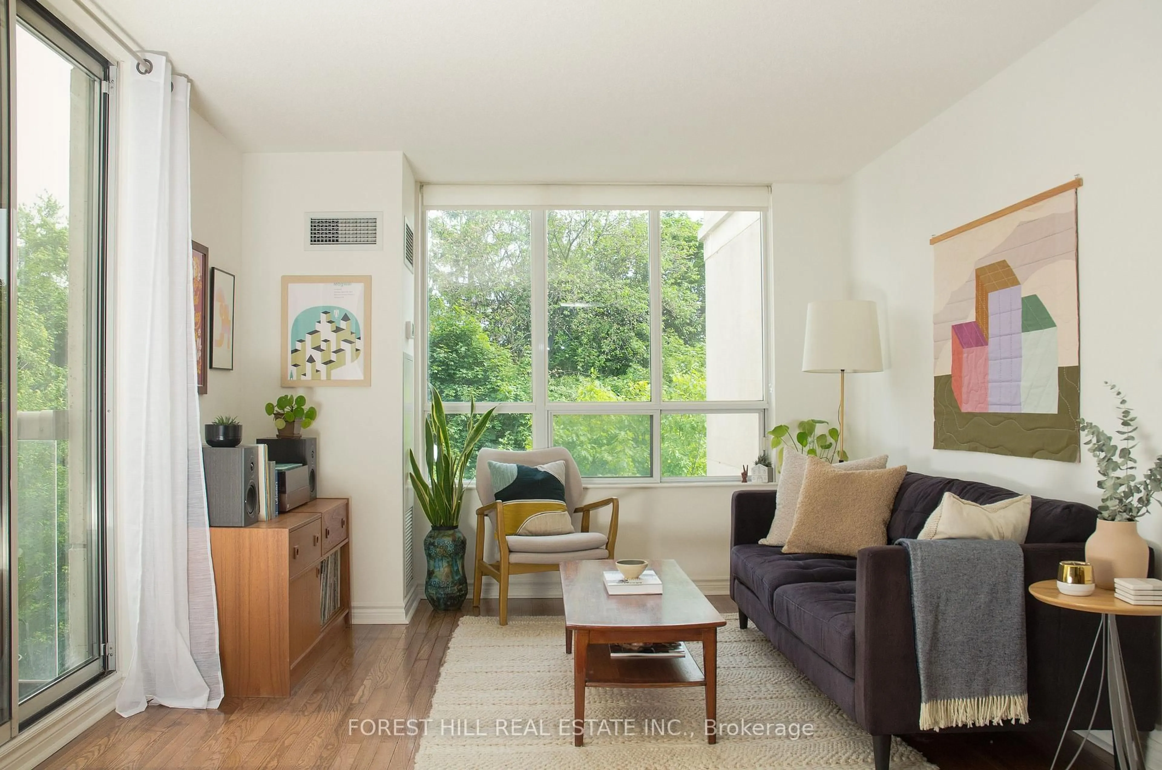 Living room with furniture, wood/laminate floor for 225 Merton St #602, Toronto Ontario M4S 3H1