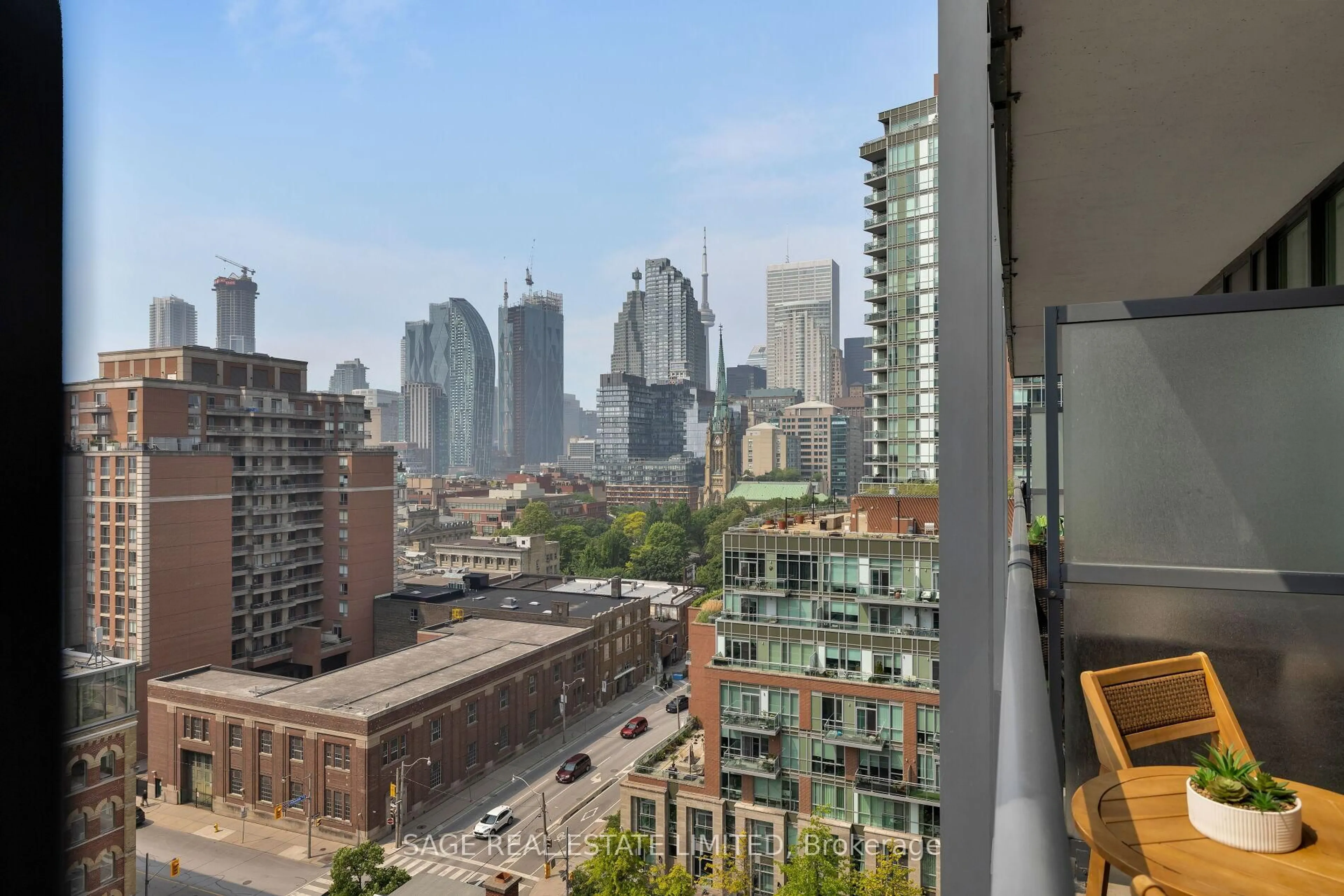 Balcony in the apartment, city buildings view from balcony for 105 George St #1108, Toronto Ontario M5A 0L4