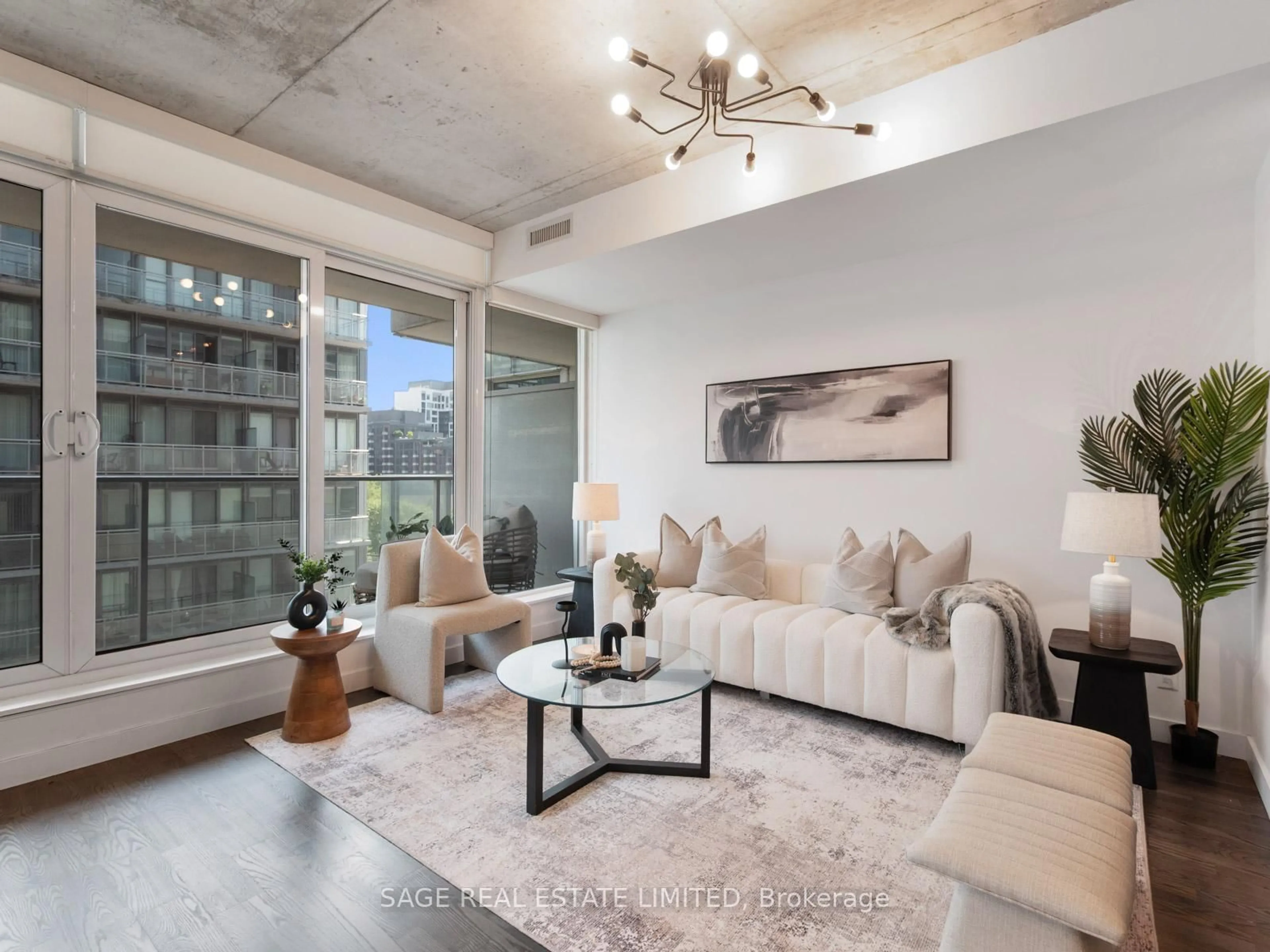 Living room with furniture, cement floor for 75 Portland St #816, Toronto Ontario M5V 2M9