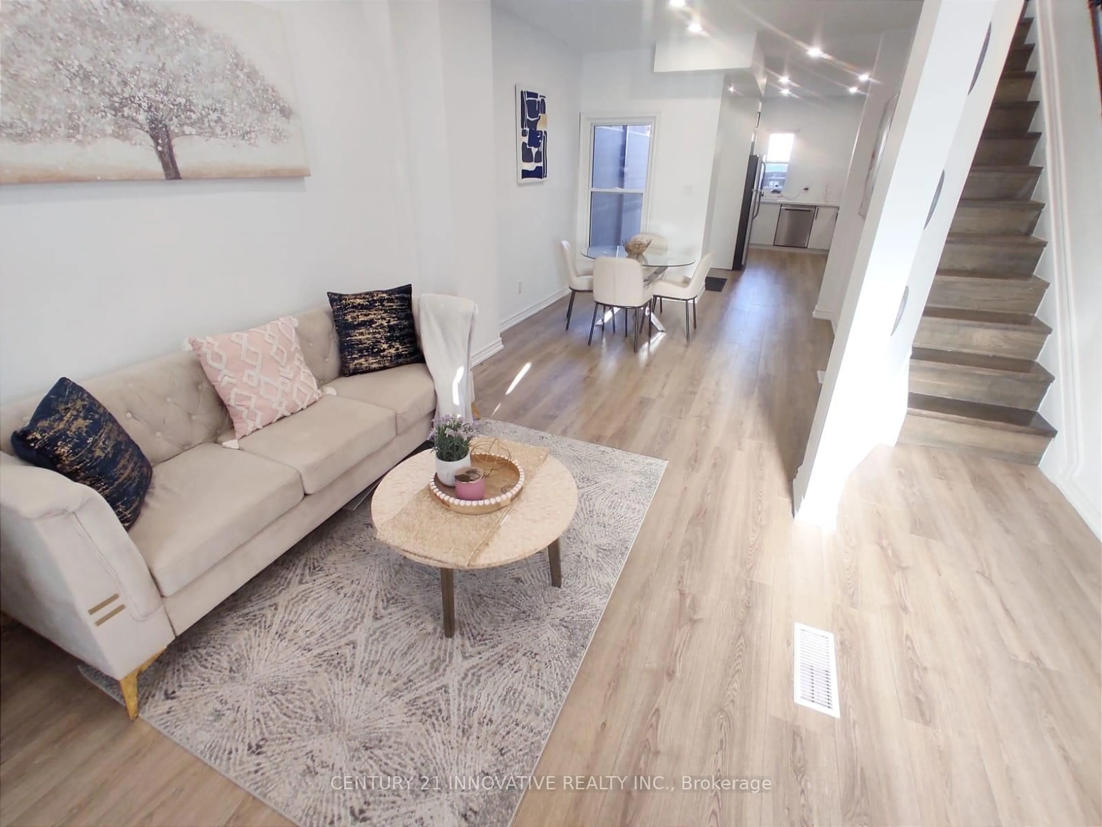 Living room with furniture, wood/laminate floor for 613 Dufferin St, Toronto Ontario M6K 2B1
