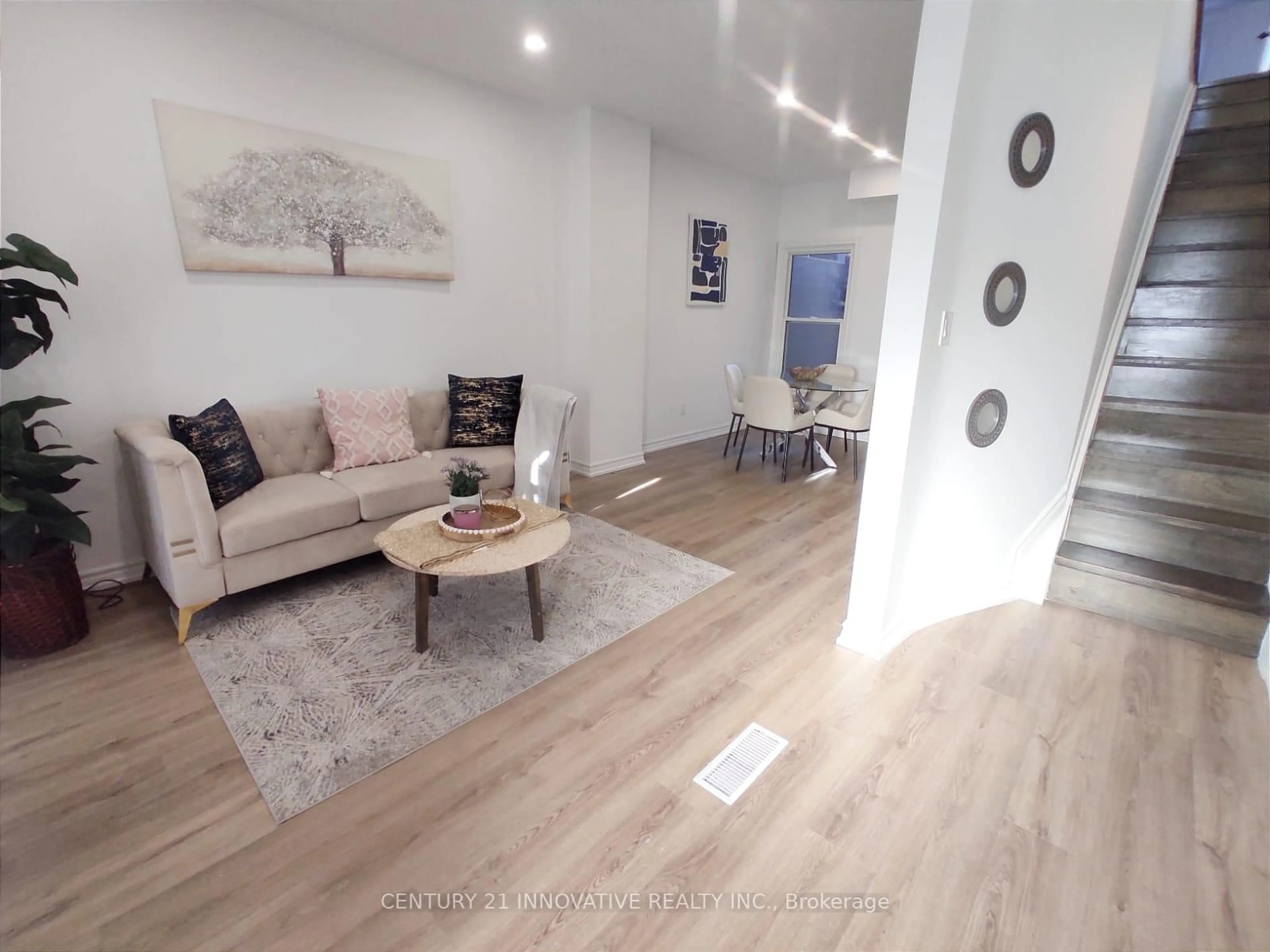 Living room with furniture, wood/laminate floor for 613 Dufferin St, Toronto Ontario M6K 2B1