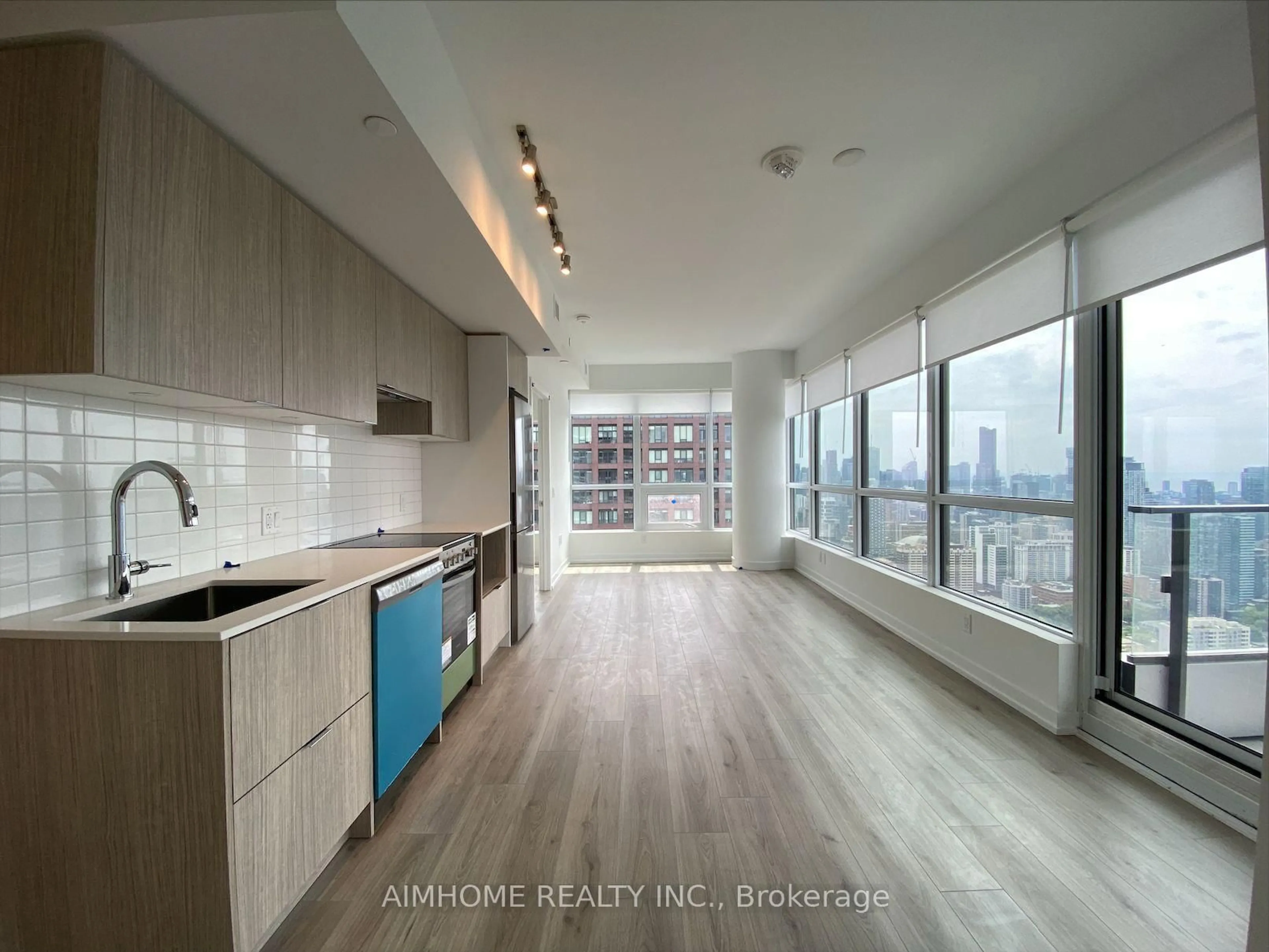 Open concept kitchen, wood/laminate floor for 395 Bloor St #4902, Toronto Ontario M4W 1H7