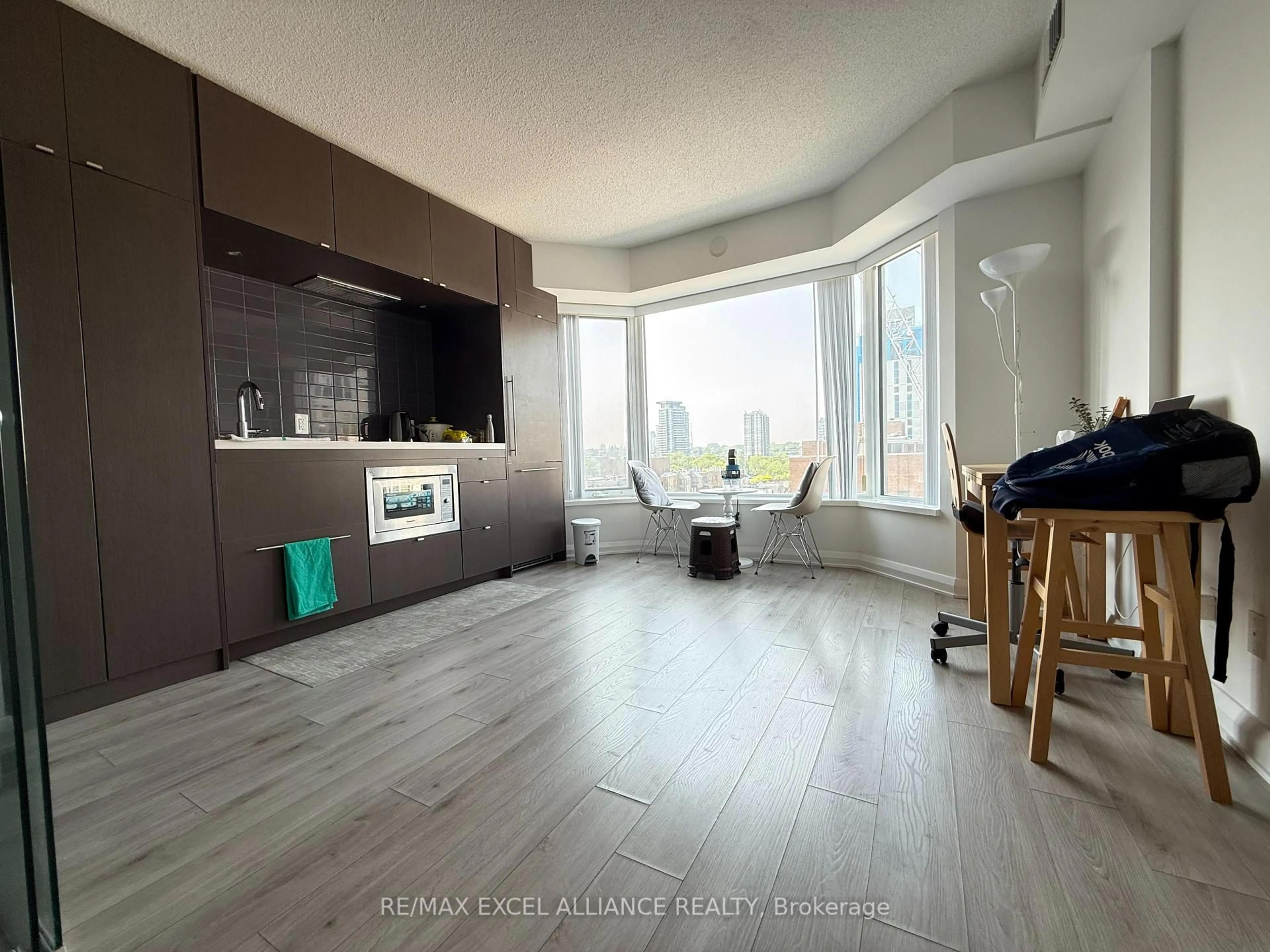 Living room with furniture, wood/laminate floor for 155 Yorkville Ave #801, Toronto Ontario M5R 1C4