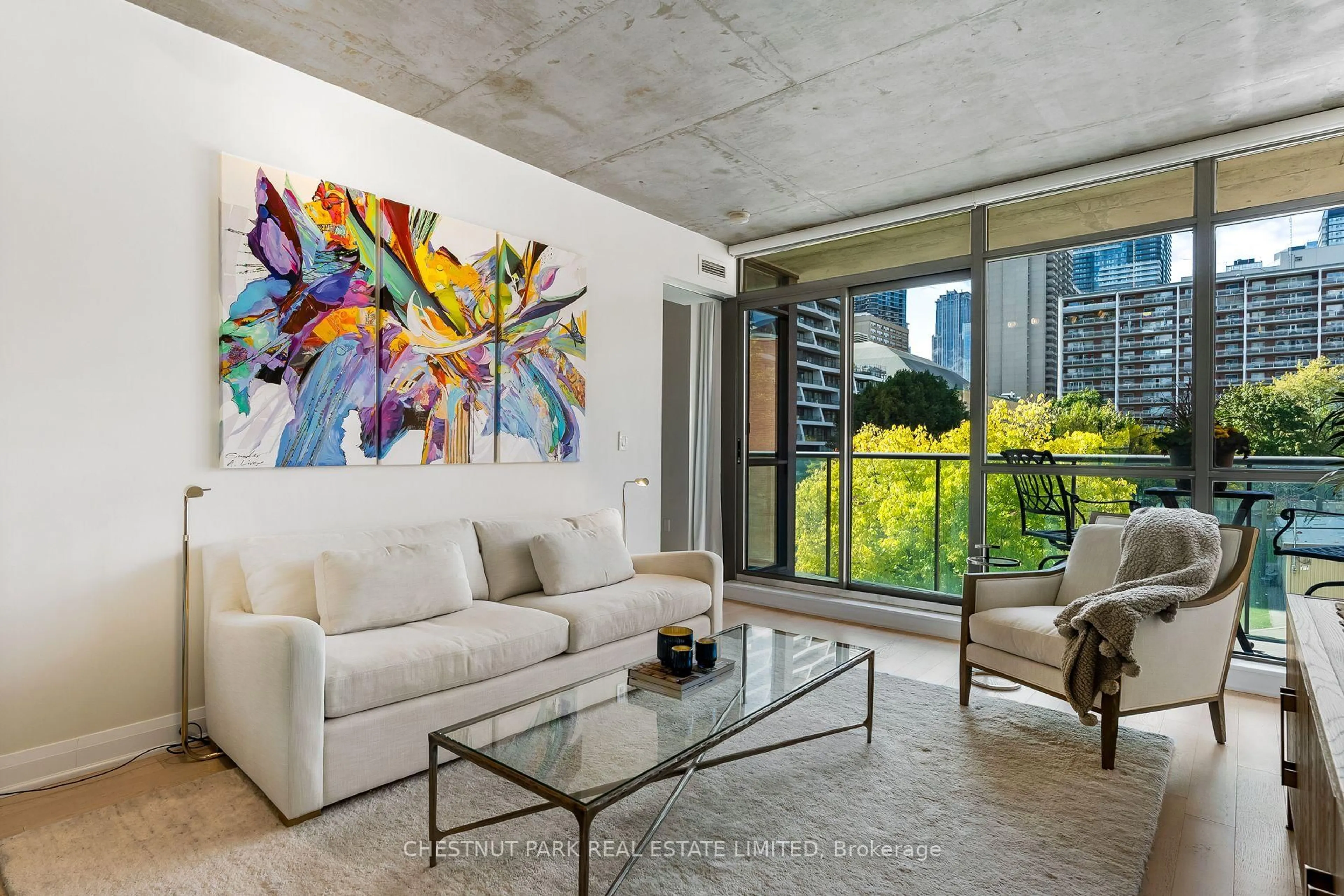 Living room with furniture, cement floor for 285 Mutual St #302, Toronto Ontario M4Y 3C5