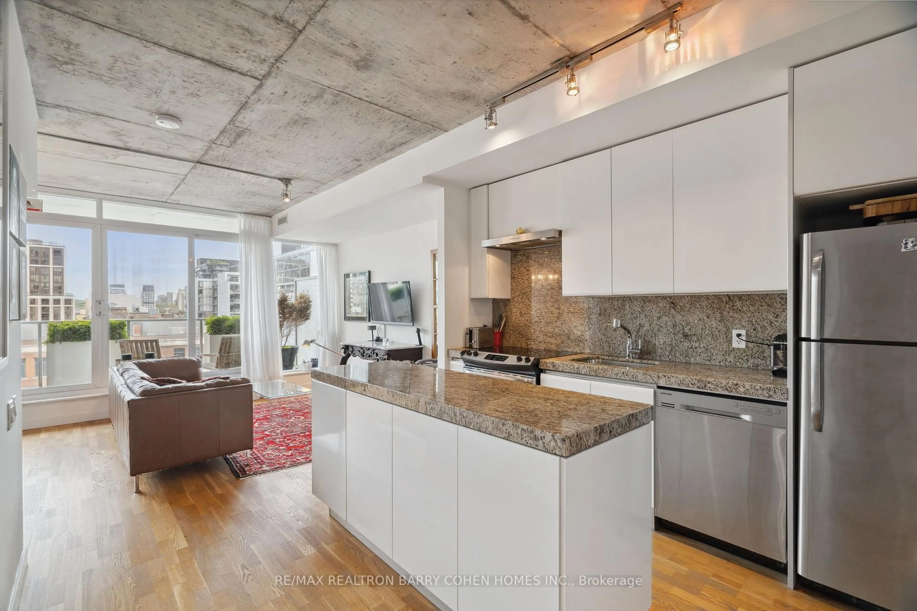 Open concept kitchen, cement floor for 75 Portland St #911, Toronto Ontario M5V 2M9
