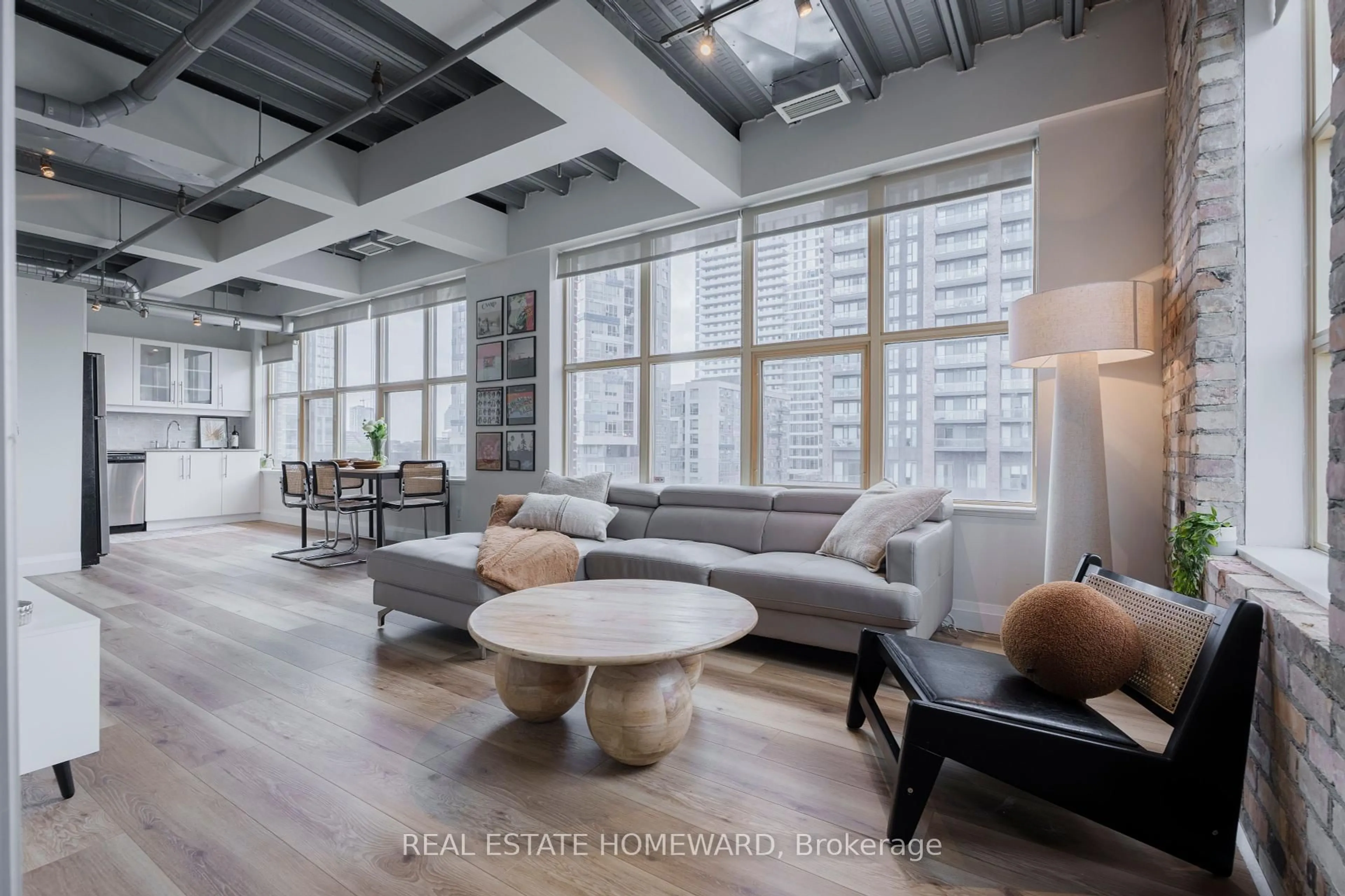 Living room with furniture, cement floor for 736 Dundas St #607, Toronto Ontario M5A 2C5