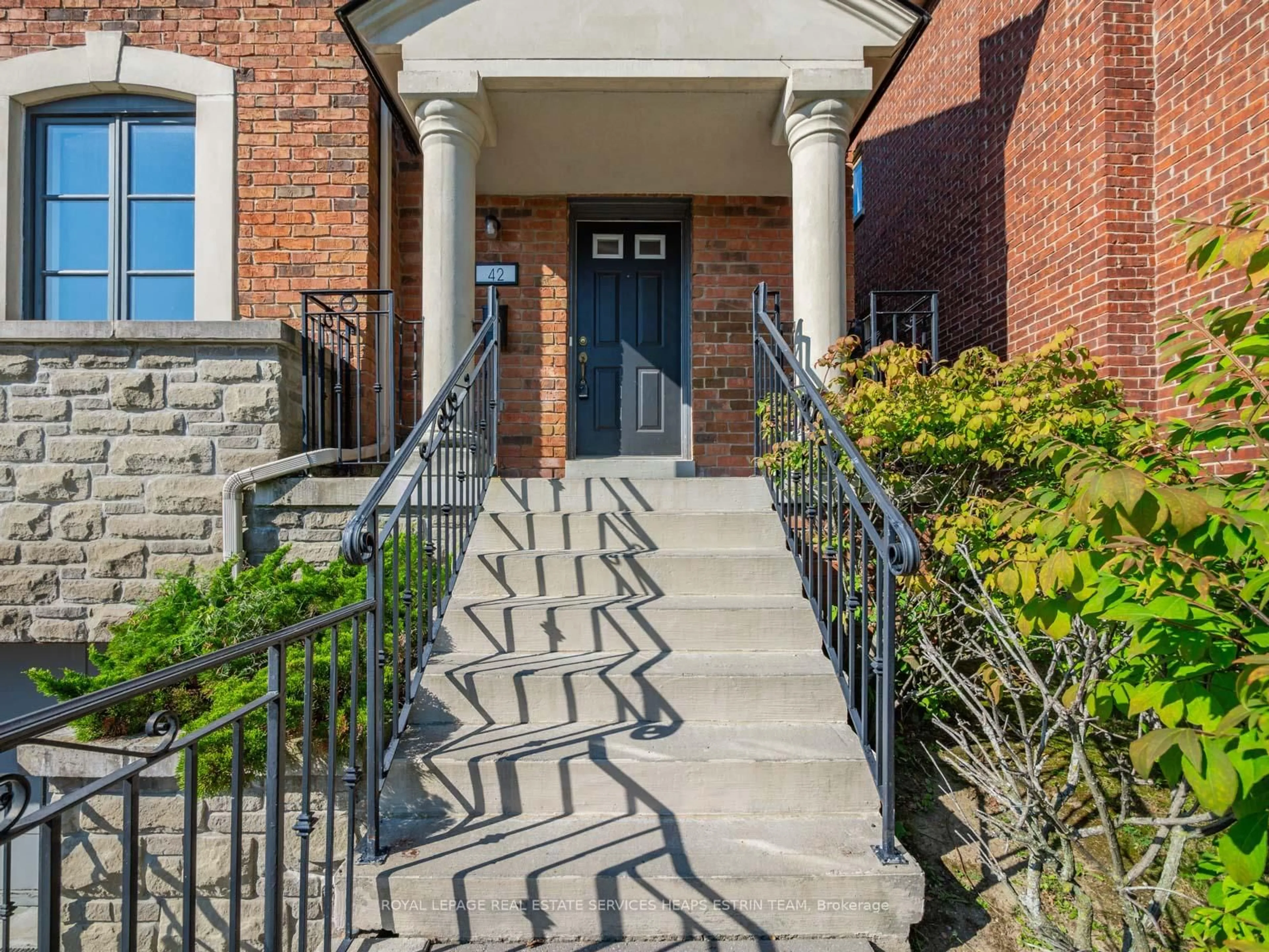 Home with brick exterior material, street for 42 True Davidson Dr, Toronto Ontario M4W 3X5