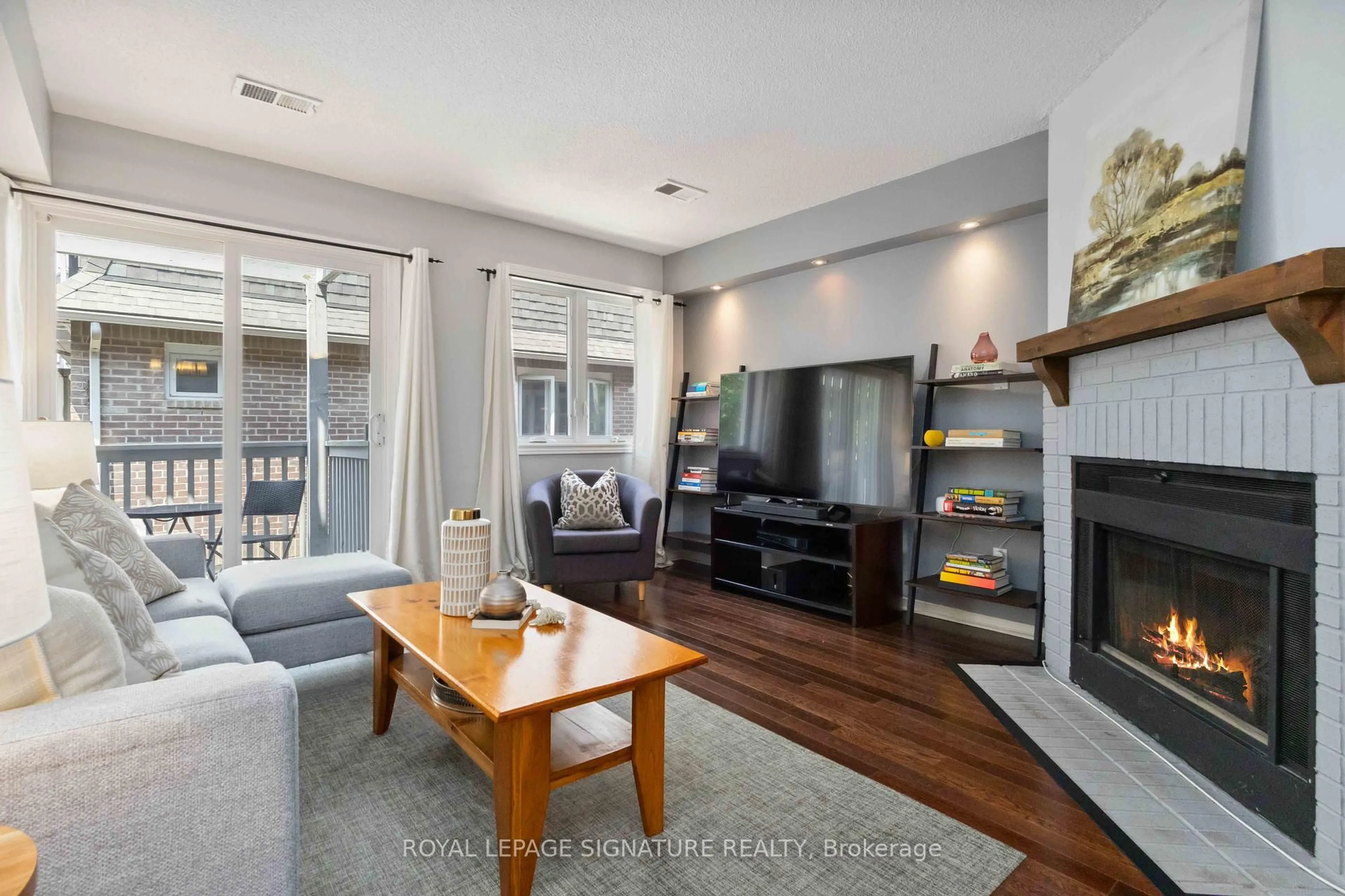 Living room with furniture, wood/laminate floor for 36B Massey St, Toronto Ontario M6J 3T7