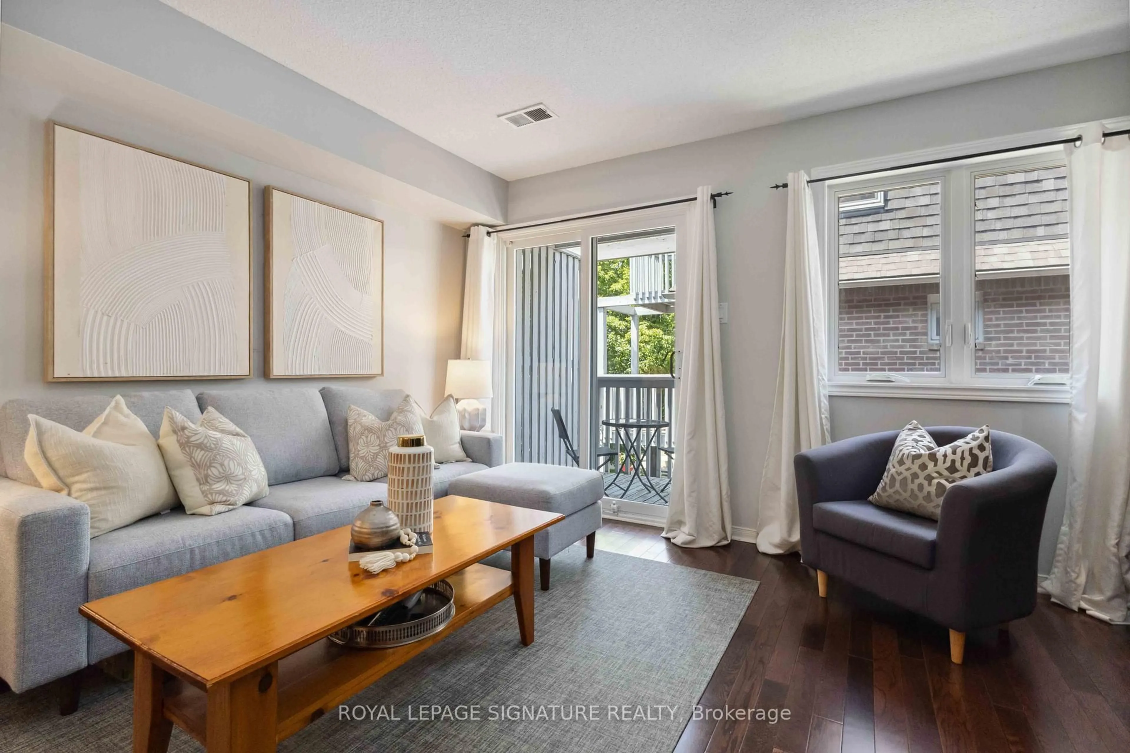 Living room with furniture, wood/laminate floor for 36B Massey St, Toronto Ontario M6J 3T7