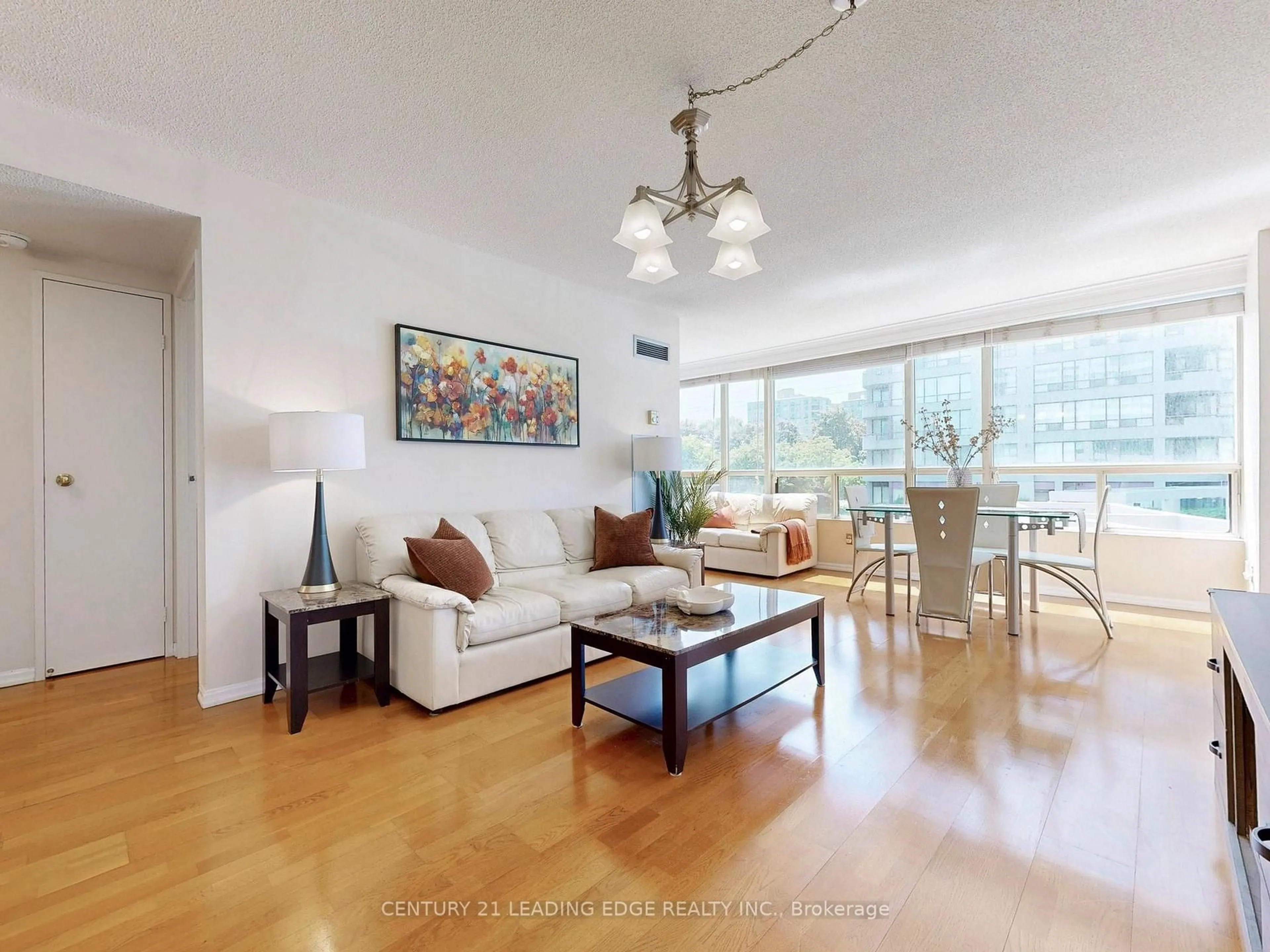 Living room with furniture, wood/laminate floor for 5785 Yonge St #205, Toronto Ontario M2M 4J2