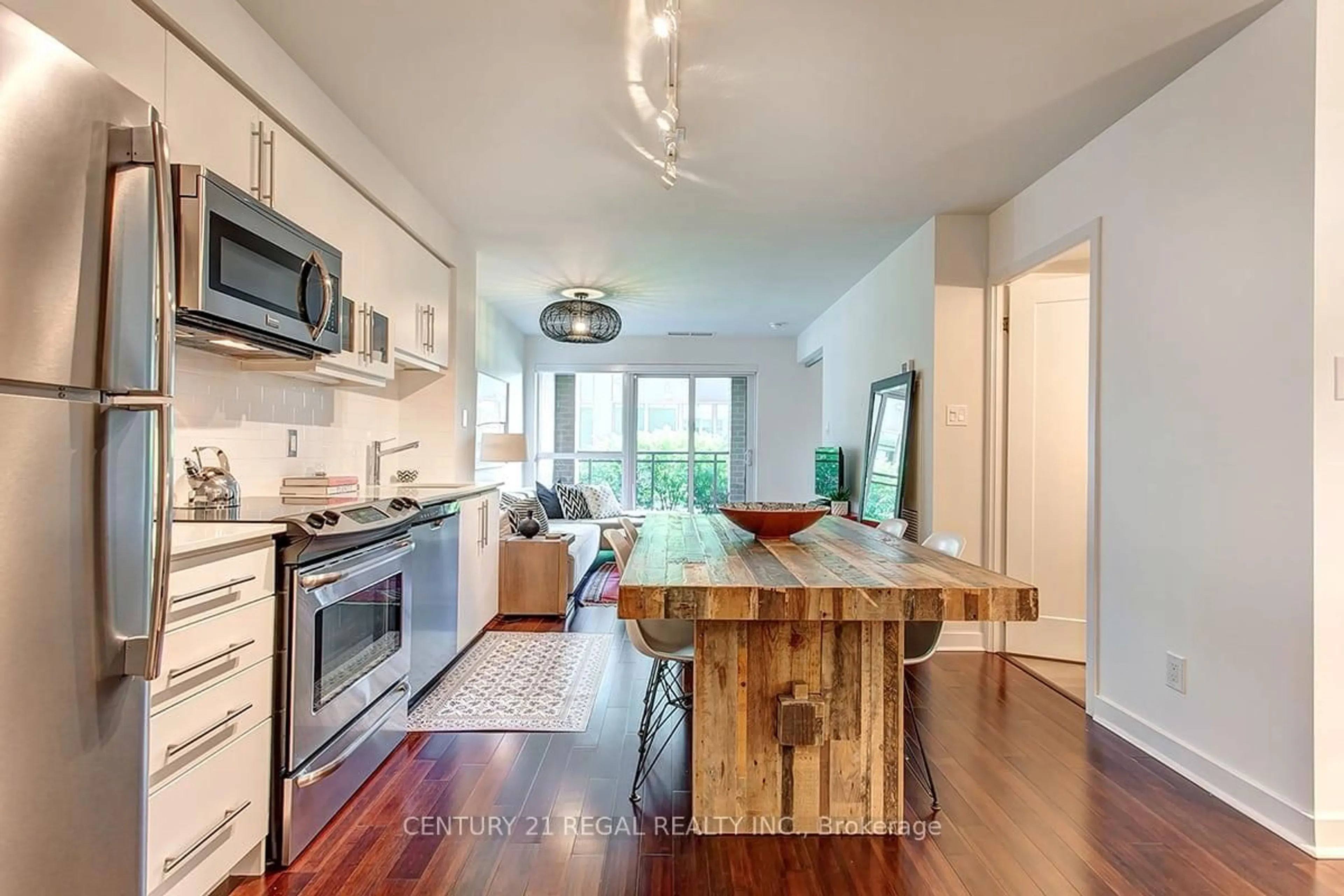 Open concept kitchen, wood/laminate floor for 1169 Queen St #N202, Toronto Ontario M6J 0A4