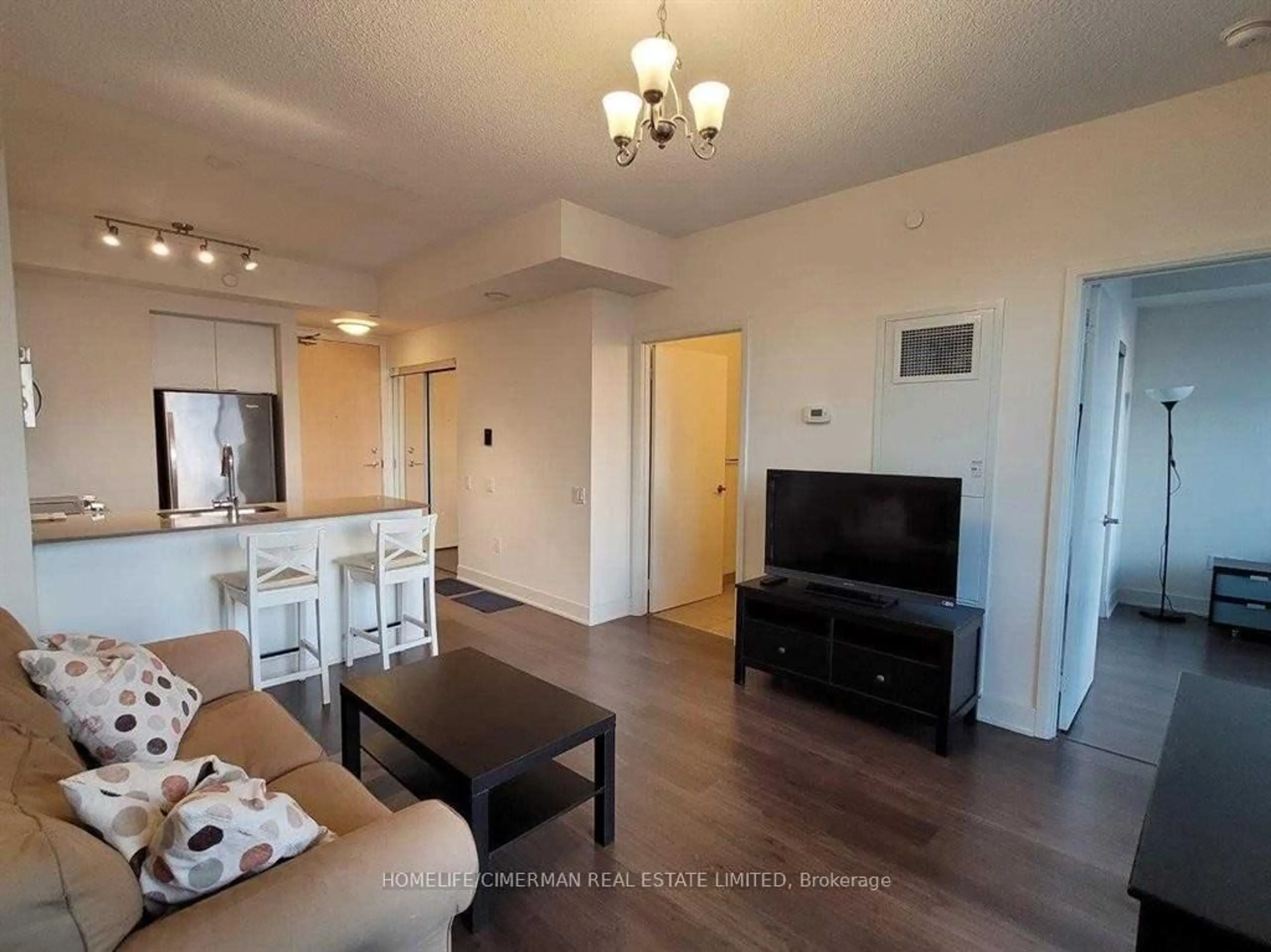 Living room with furniture, wood/laminate floor for 30 Roehampton Ave #2603, Toronto Ontario M4P 0B9