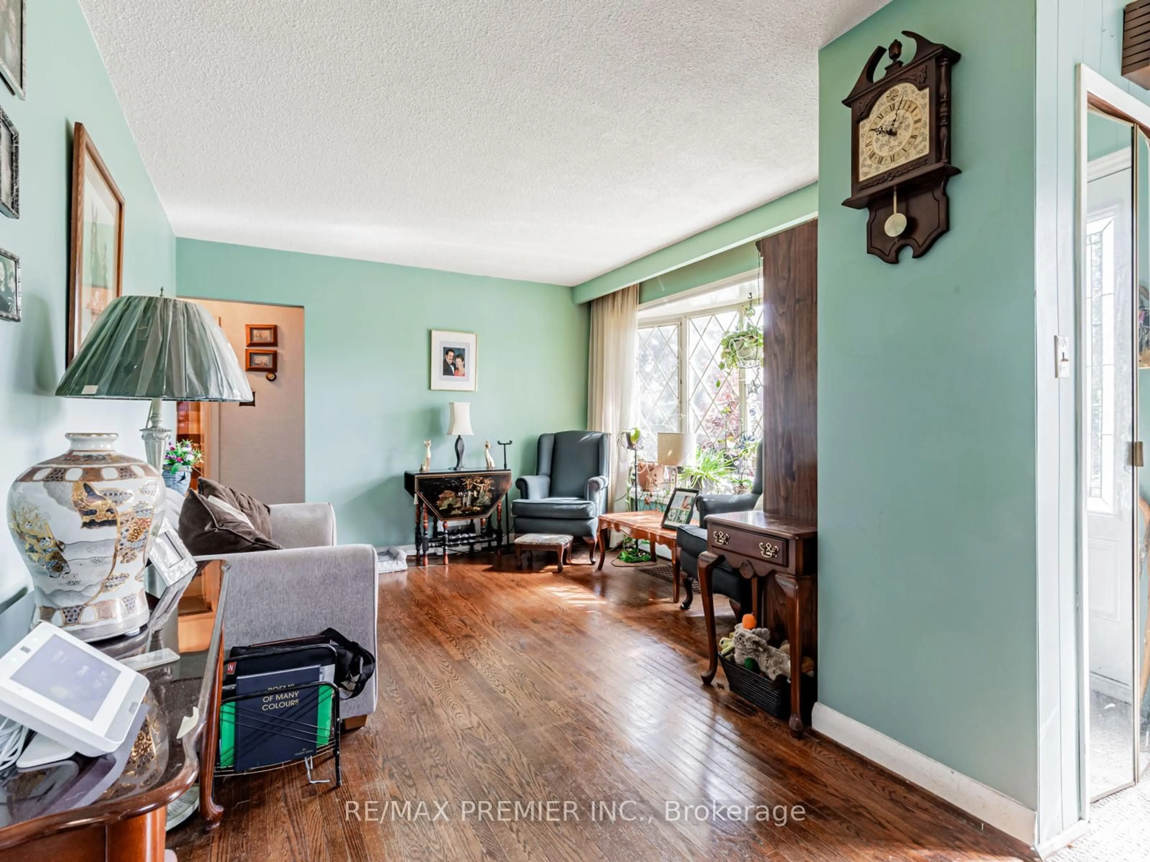 Living room with furniture, wood/laminate floor for 16 Goddard St, Toronto Ontario M3H 5C6