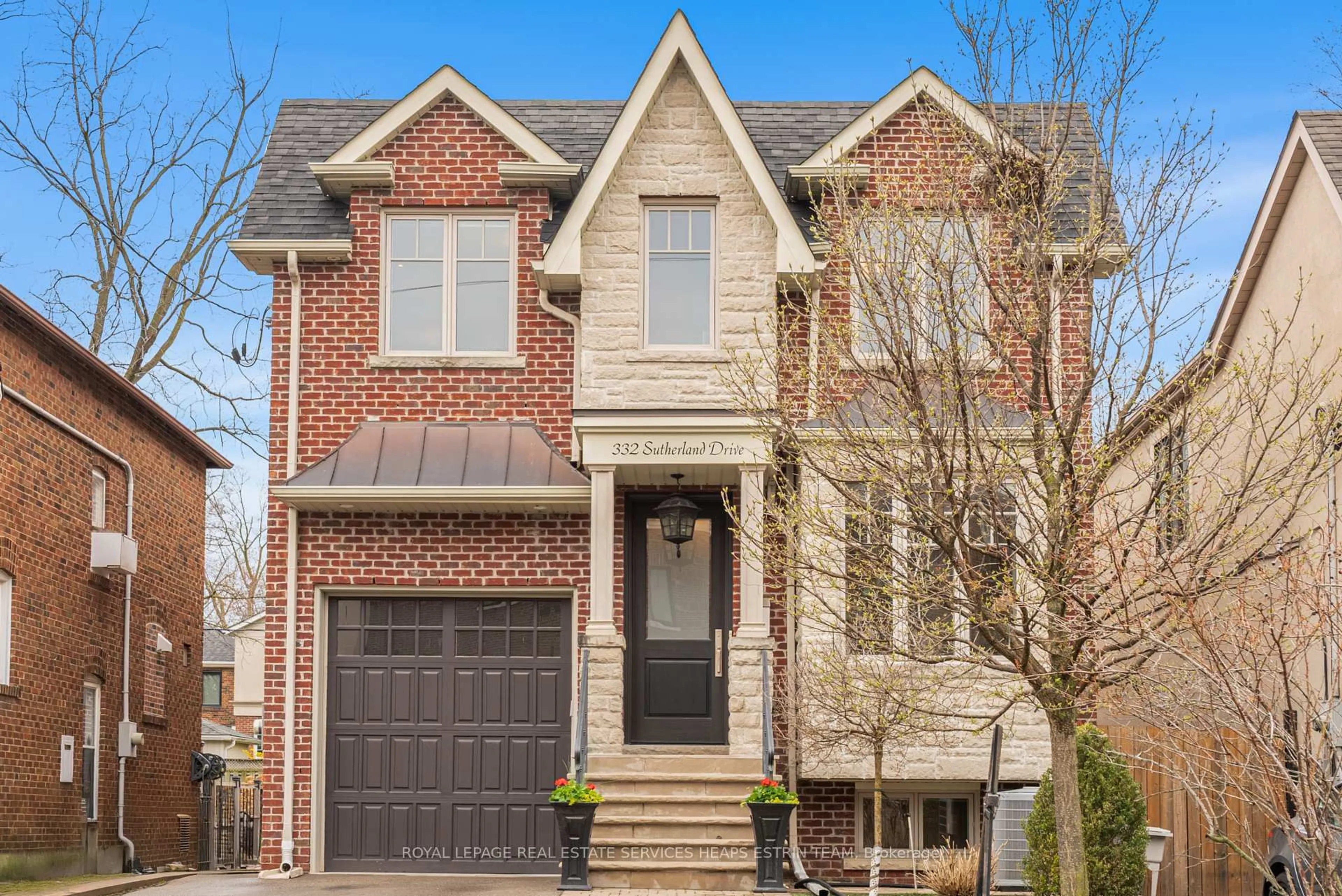 Home with brick exterior material, street for 332 Sutherland Dr, Toronto Ontario M4G 1J8