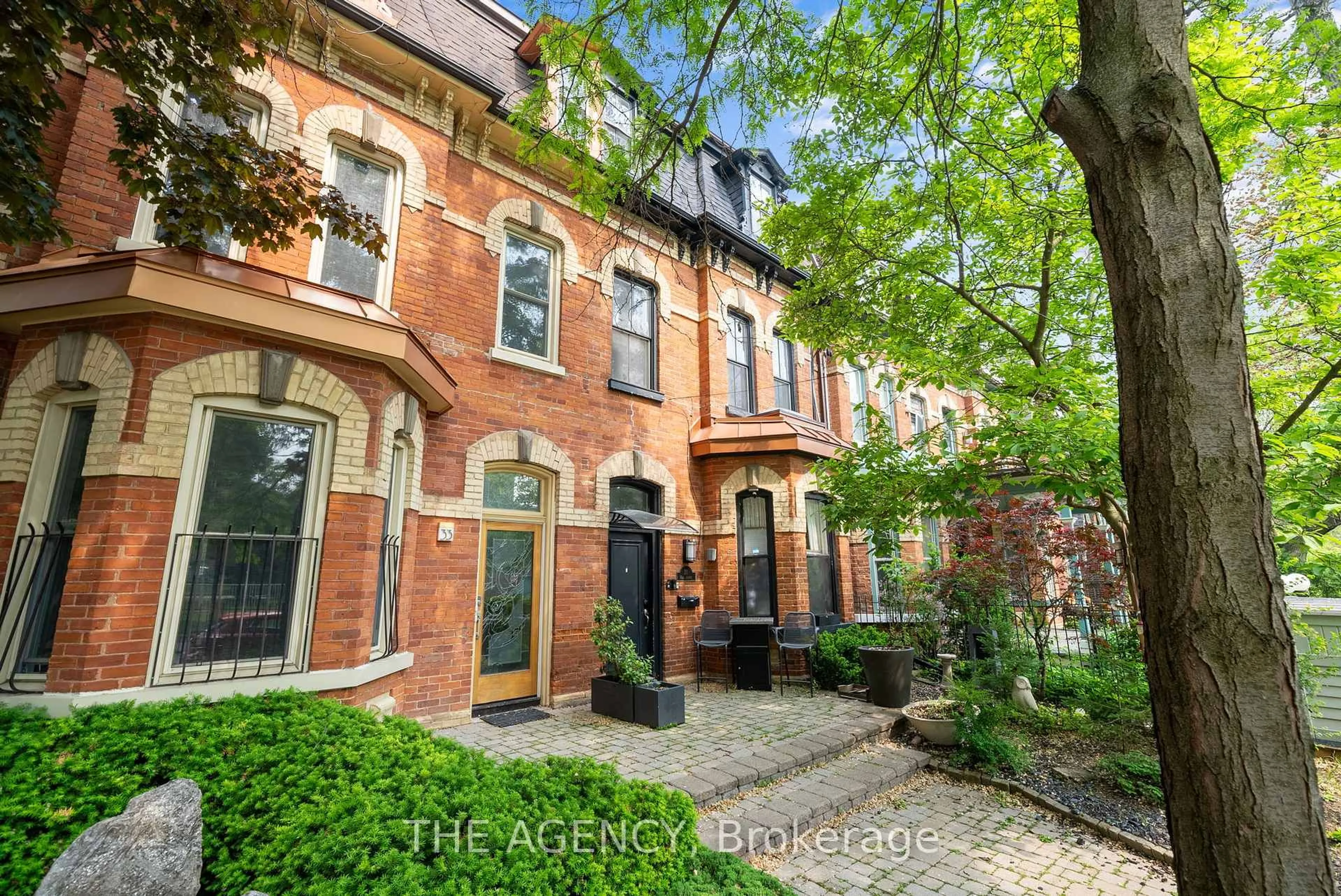 Home with brick exterior material, street for 31 Rose Ave, Toronto Ontario M4X 1N7