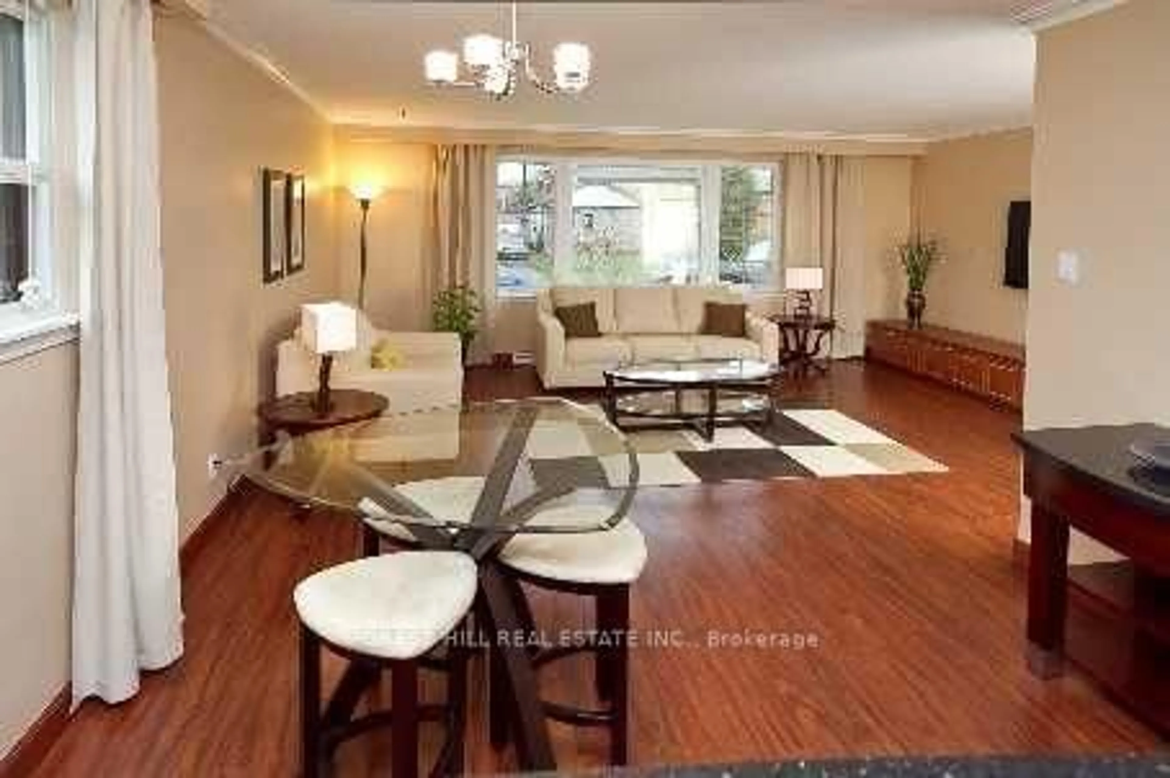 Living room with furniture, wood/laminate floor for 31 Danby Ave, Toronto Ontario M3H 2J2