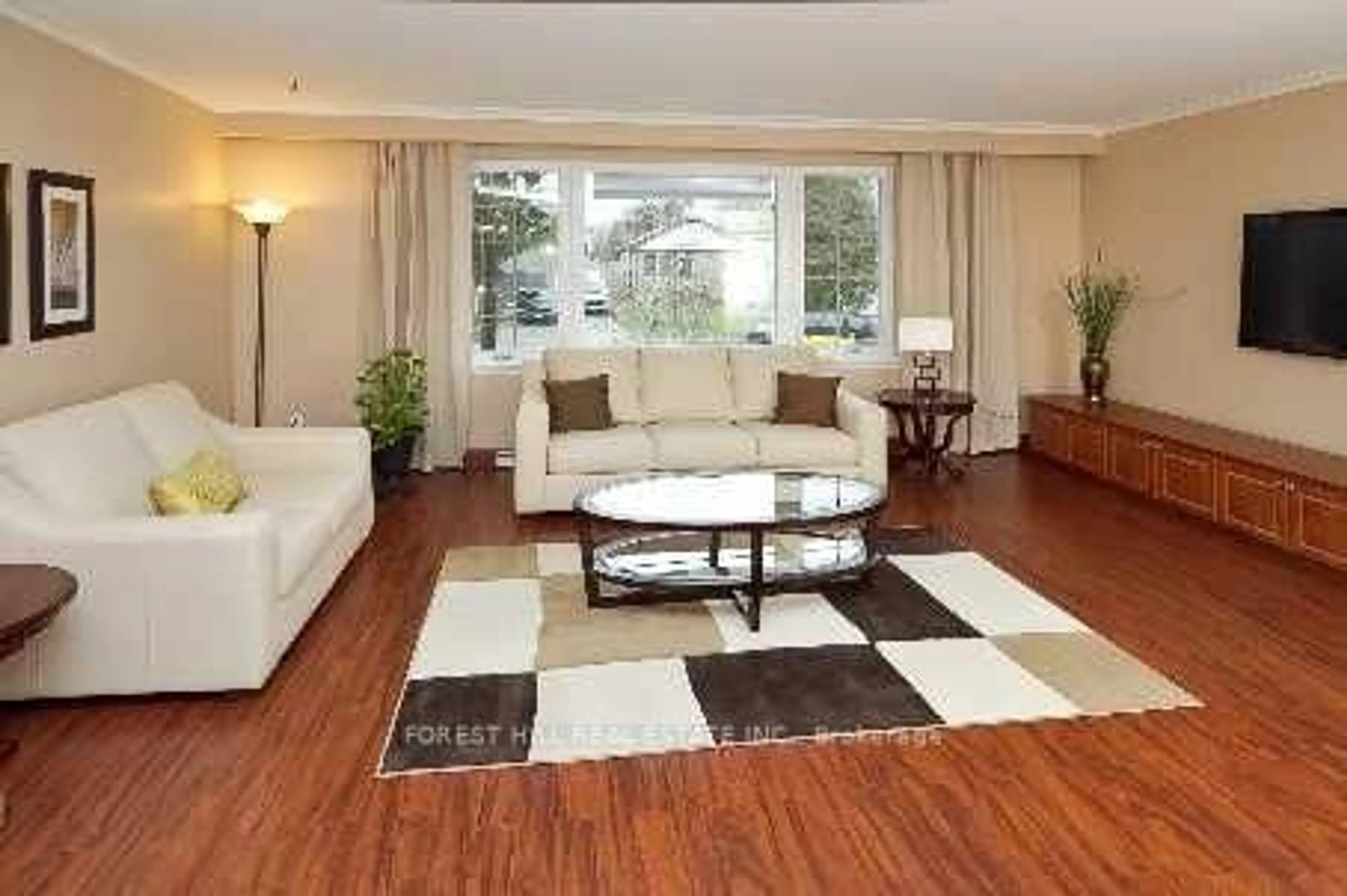 Living room with furniture, wood/laminate floor for 31 Danby Ave, Toronto Ontario M3H 2J2