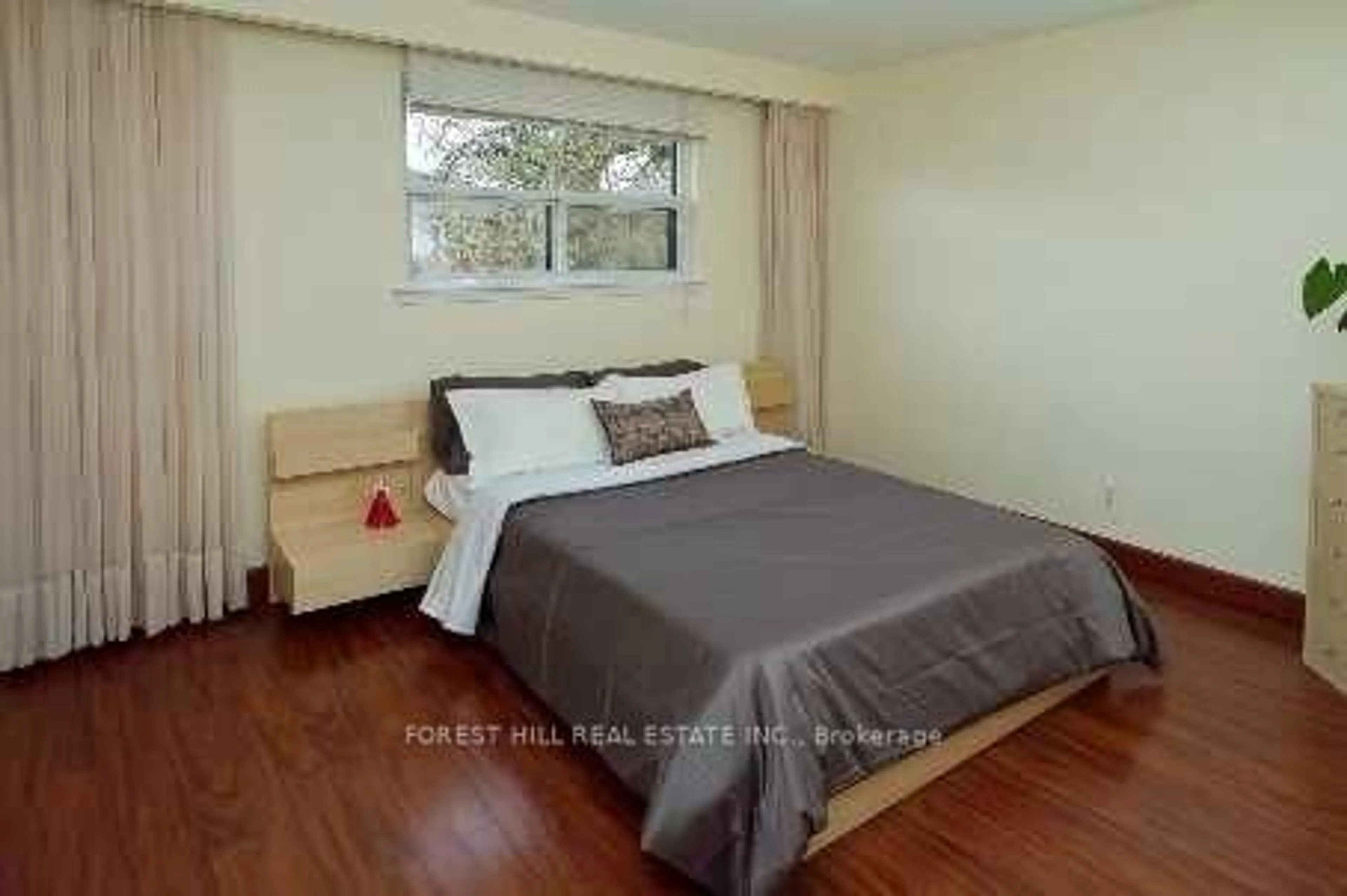 Bedroom with bed, wood/laminate floor for 31 Danby Ave, Toronto Ontario M3H 2J2