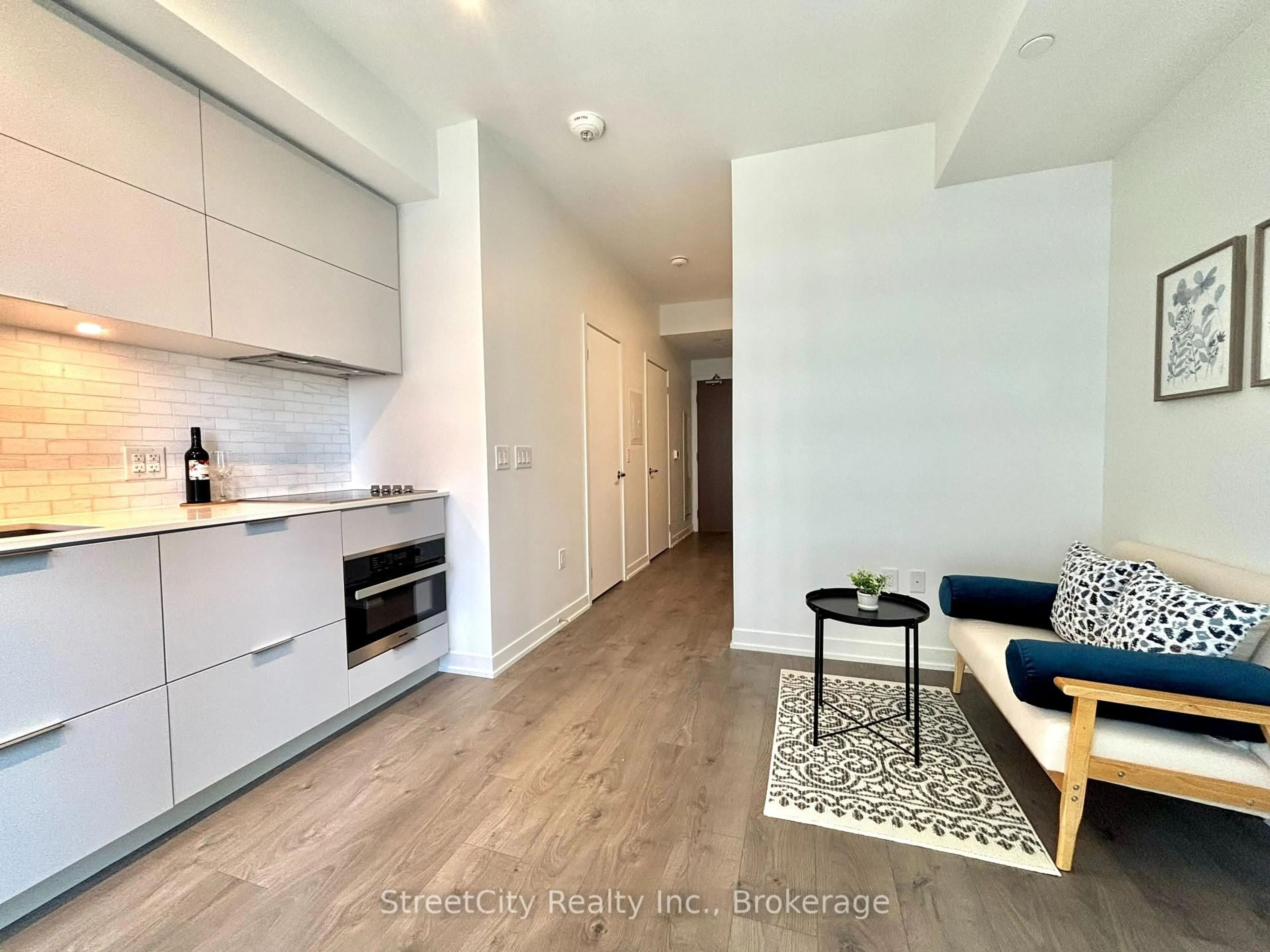 Open concept kitchen, wood/laminate floor for 20 Richardson St #611, Toronto Ontario M5A 0S6