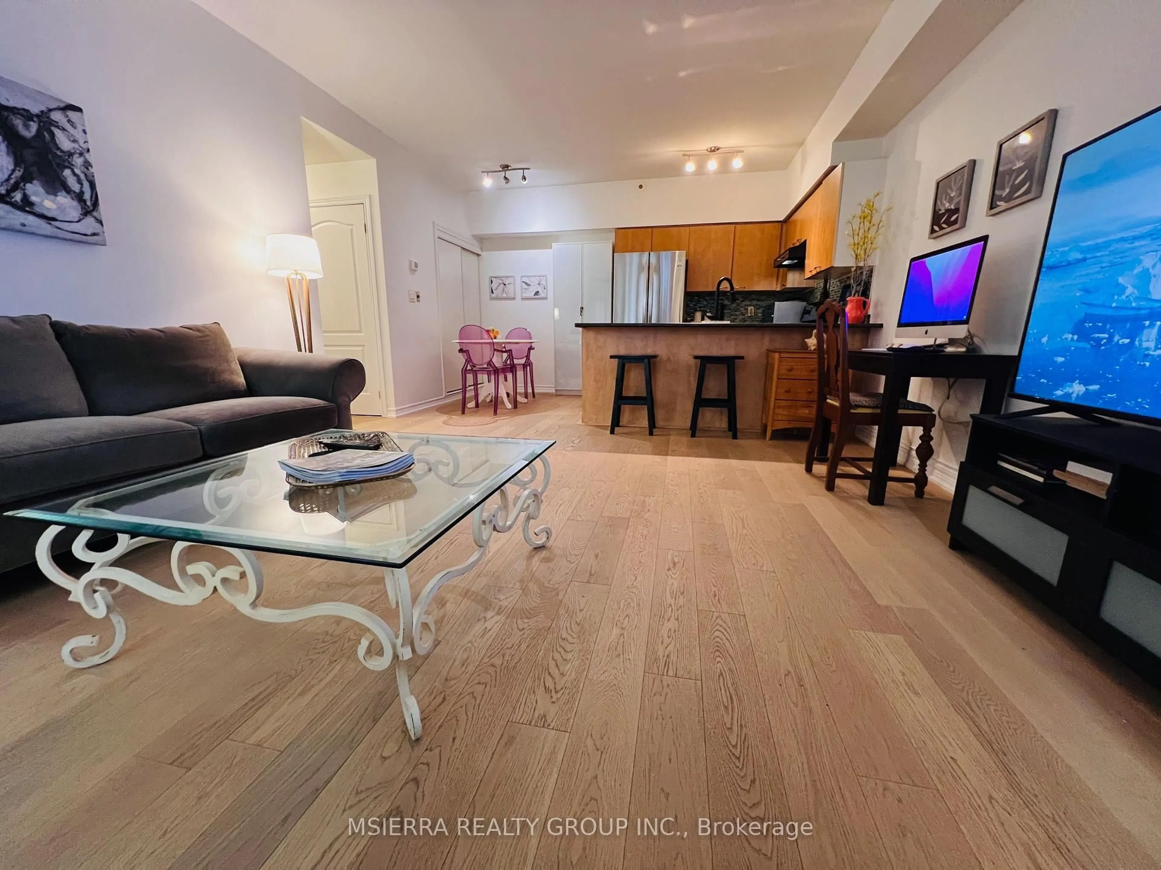 Living room with furniture, unknown for 65 Cranborne Ave #108, Toronto Ontario M4A 2Y5