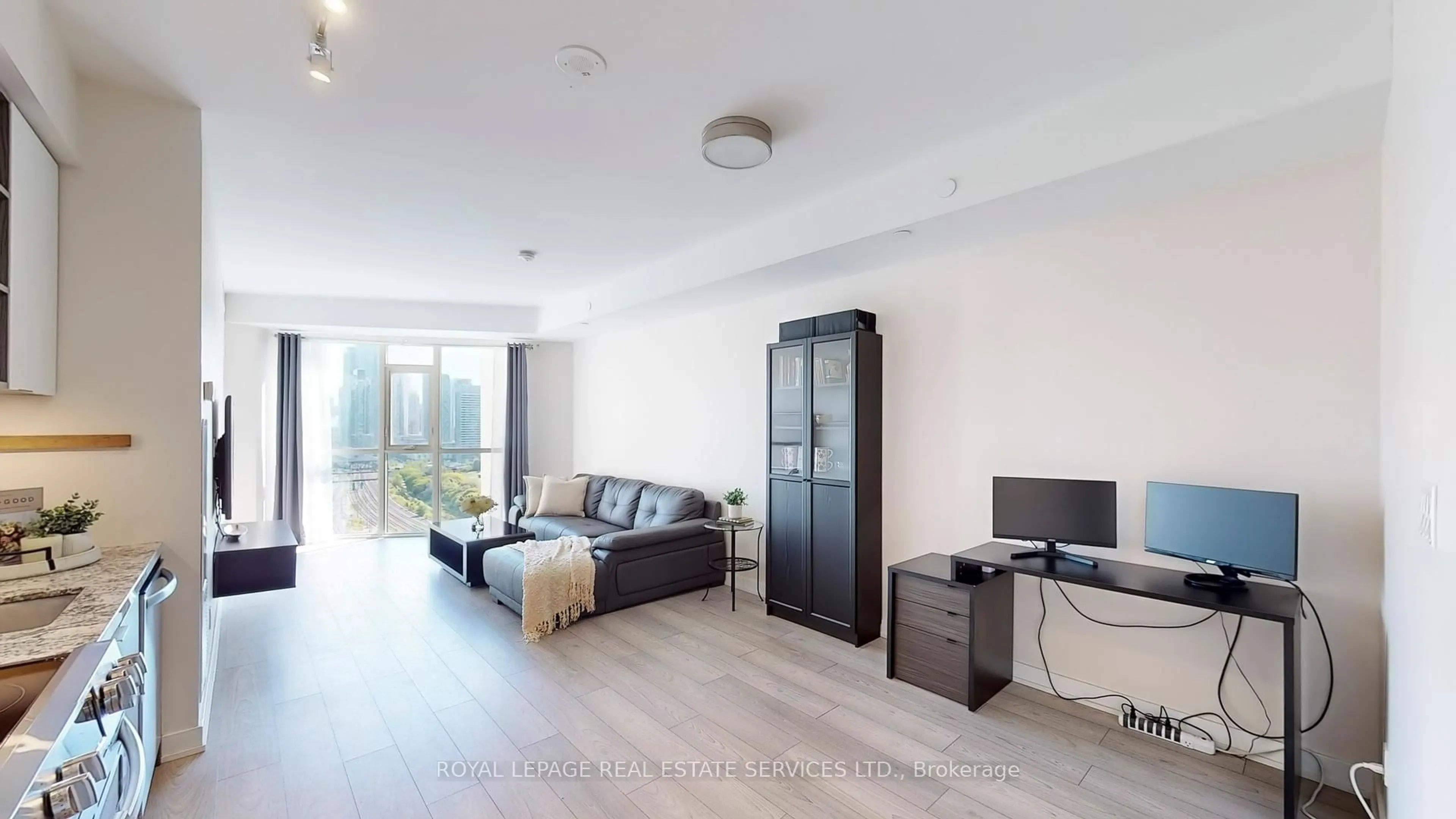 Living room with furniture, wood/laminate floor for 30 Ordnance St #1510, Toronto Ontario M6K 0C8