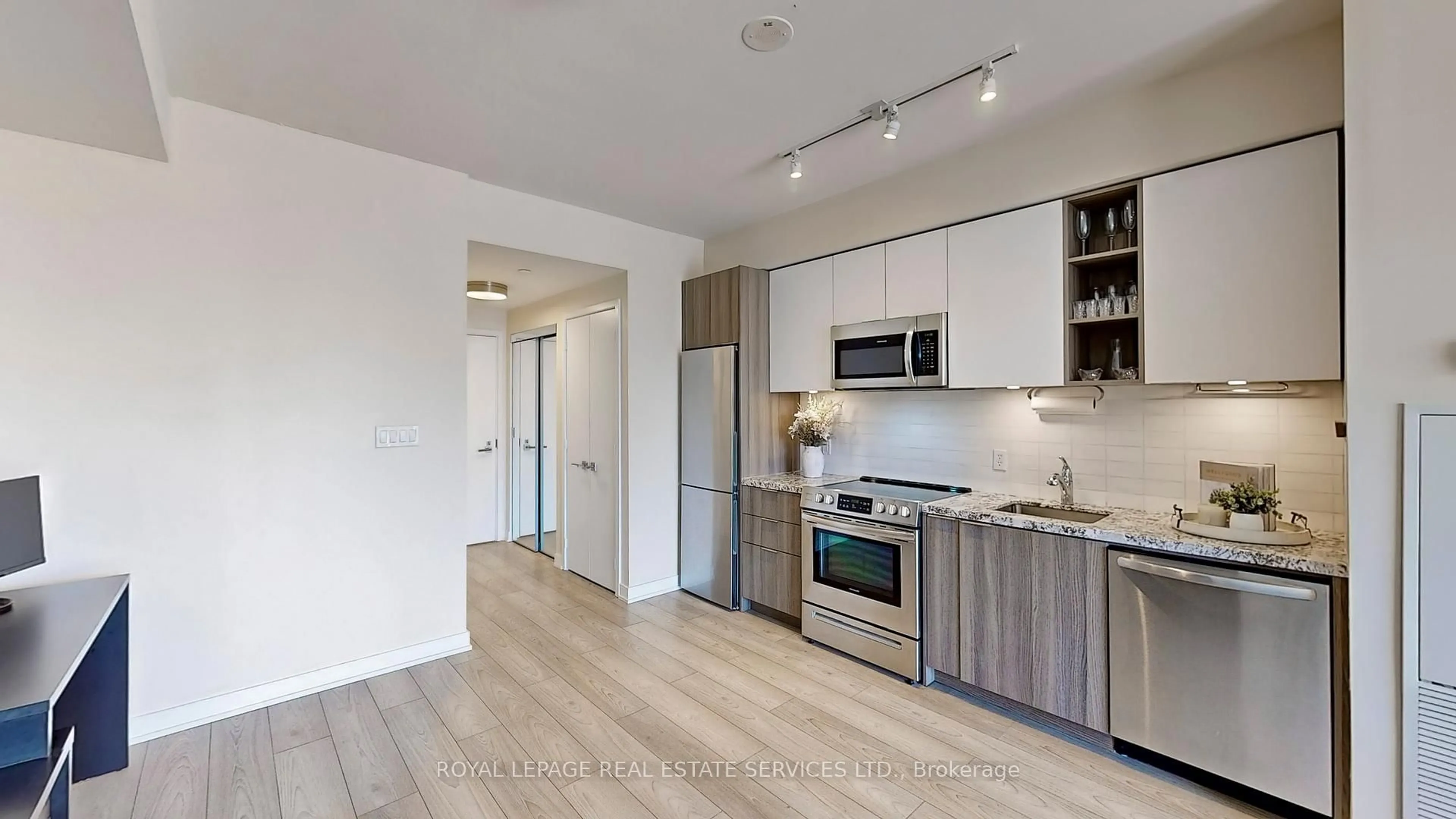 Open concept kitchen, wood/laminate floor for 30 Ordnance St #1510, Toronto Ontario M6K 0C8